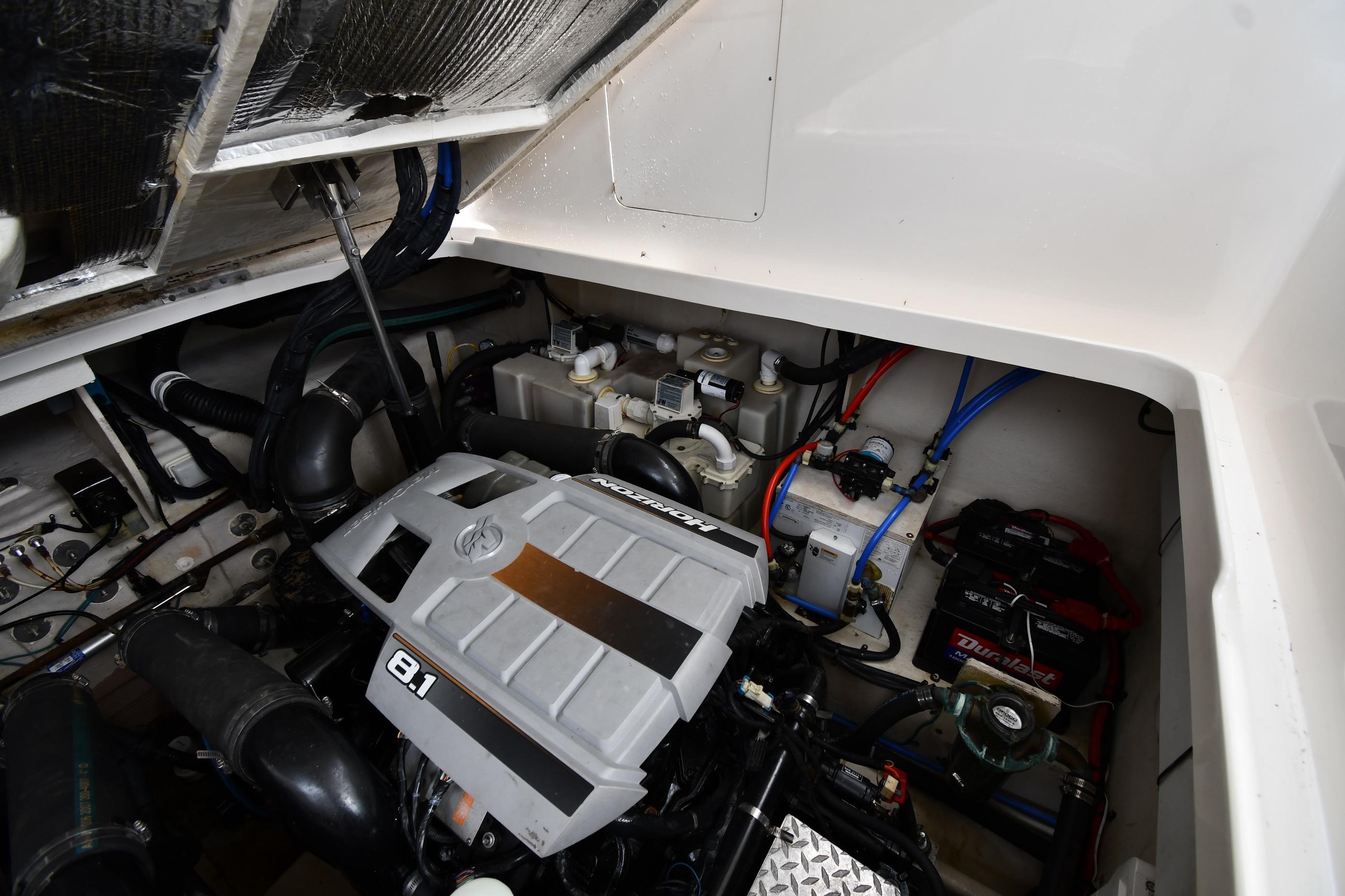 Engine compartment of a 2008 Sea Ray Sundancer 350 boat, showcasing mechanical components.
