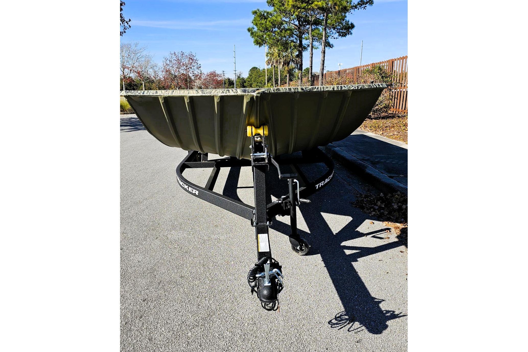 2026 Tracker Grizzly 2072 Utility boat on trailer, parked outdoors.