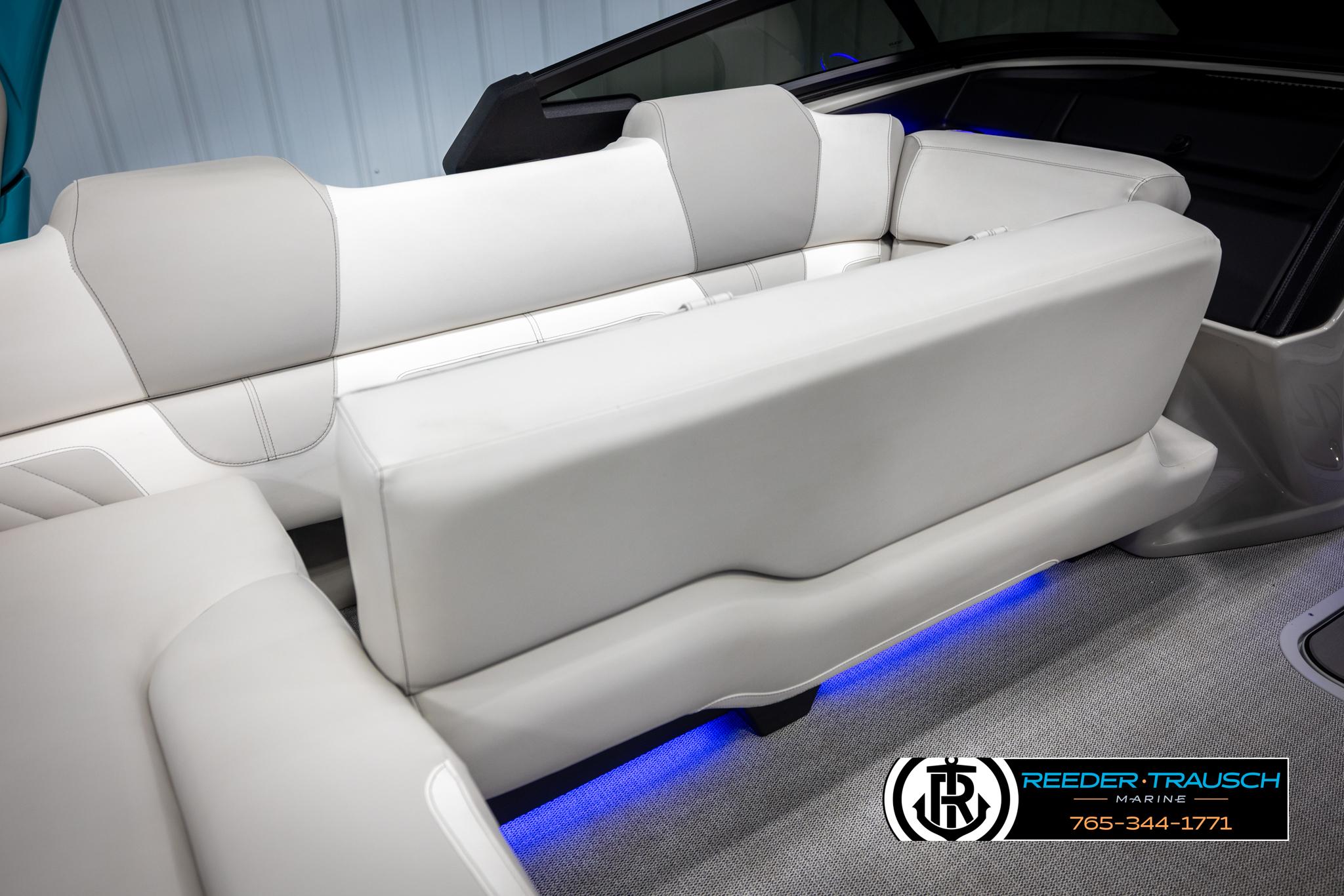 Luxurious seating in the 2025 Avalon 2585 Excal VRBW boat with ambient blue lighting.