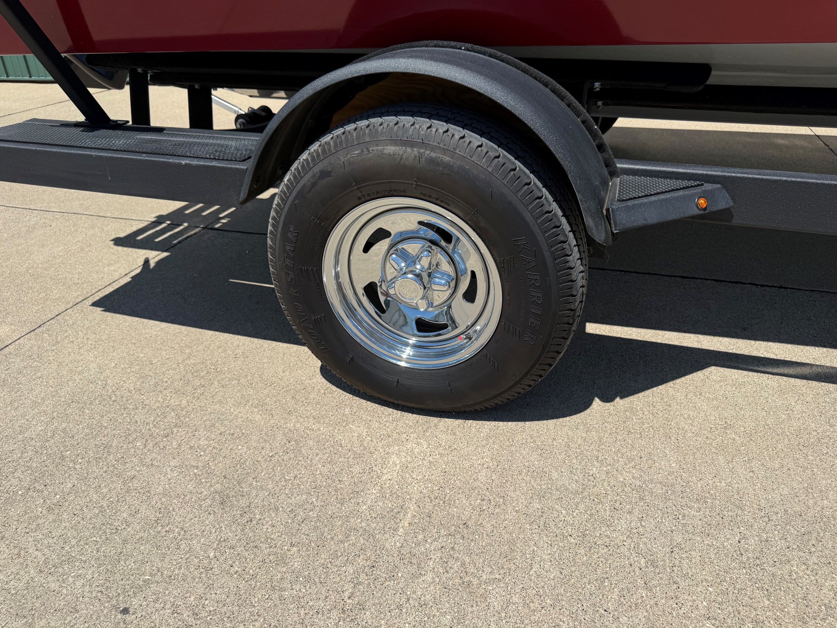 2024 Tracker Pro Guide V175 trailer tire on concrete surface.