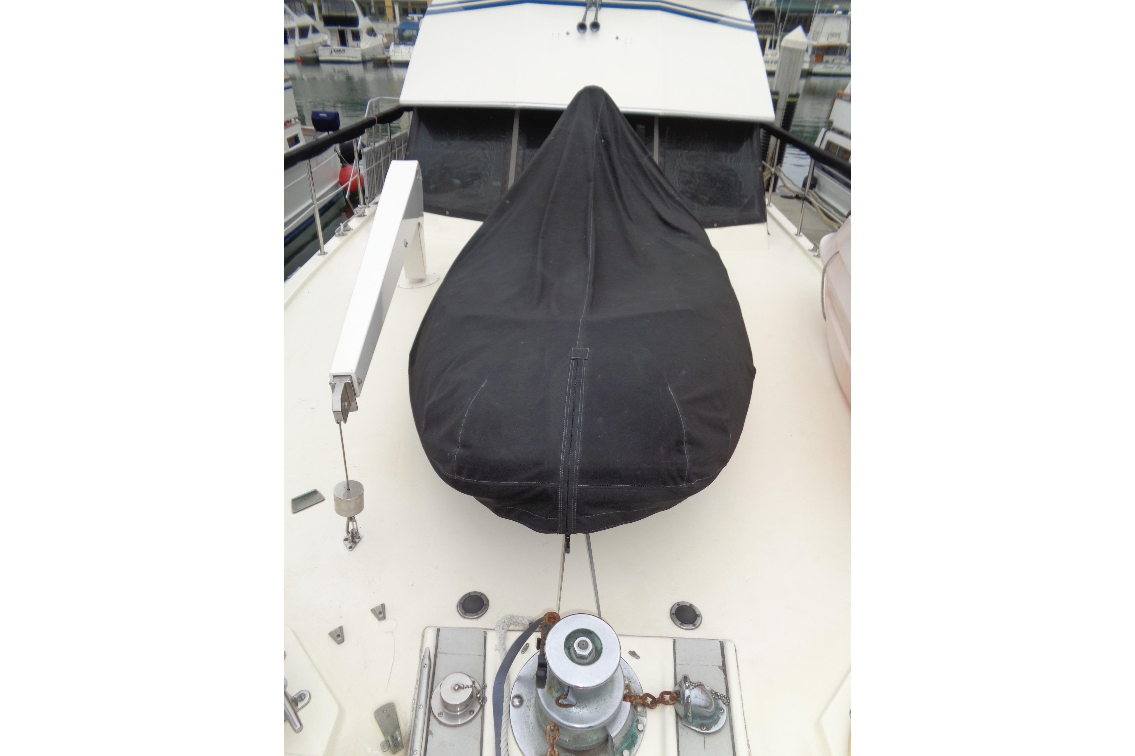 1981 Hatteras 48 Cockpit Motor Yacht deck with covered equipment.
