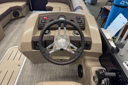 2026 Bennington 22SXSB boat helm with steering wheel and control panel.