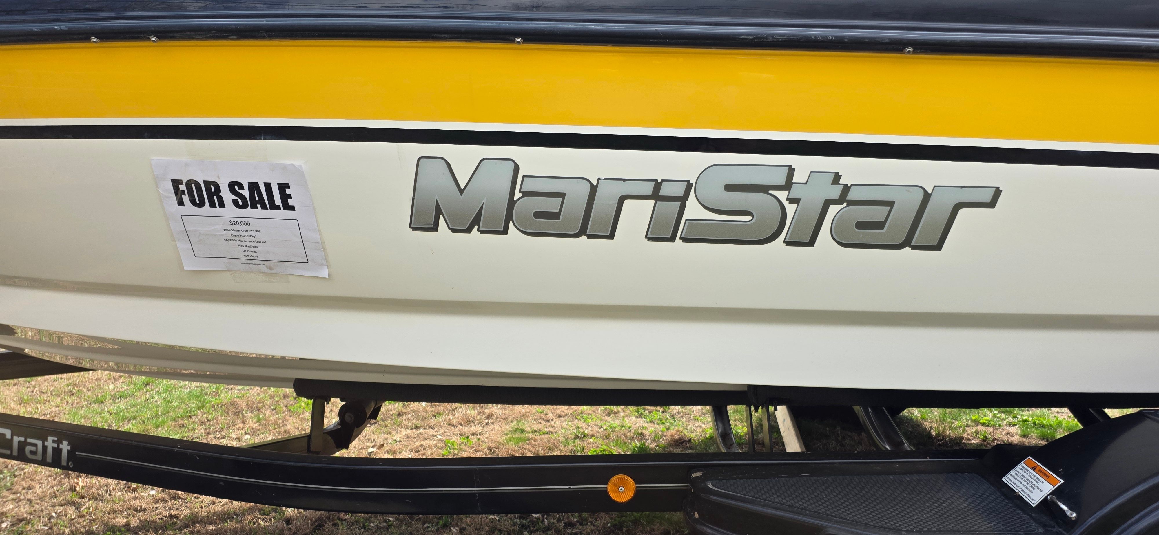 2004 MasterCraft Maristar boat for sale, yellow and white design.