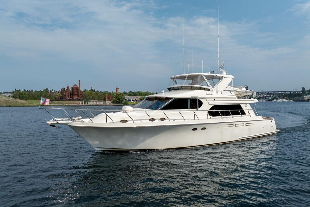 2005 Ocean Alexander 64 Motoryacht cruising on a scenic waterway.
