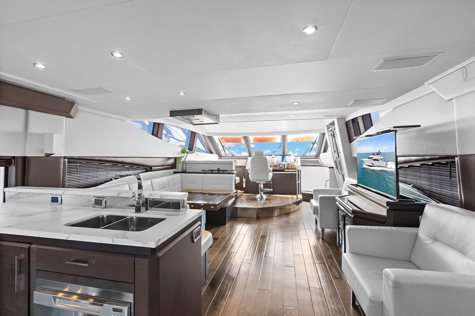 Luxurious interior of 2016 Marquis 720 Fly Bridge yacht with modern furnishings and panoramic windows.