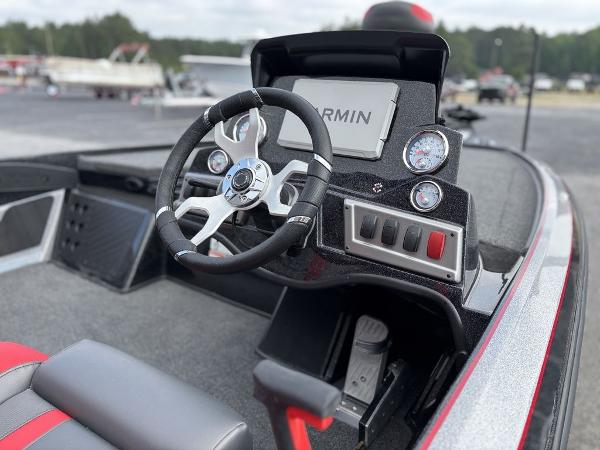 2025 Nitro Z19 Pro boat dashboard with steering wheel and Garmin display.
