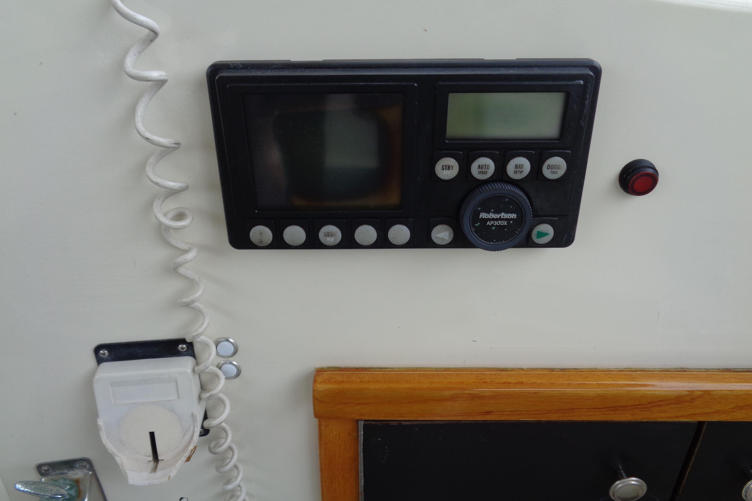 Control panel on 1981 Hatteras 48 Cockpit Motor Yacht, featuring navigation and communication equipment.