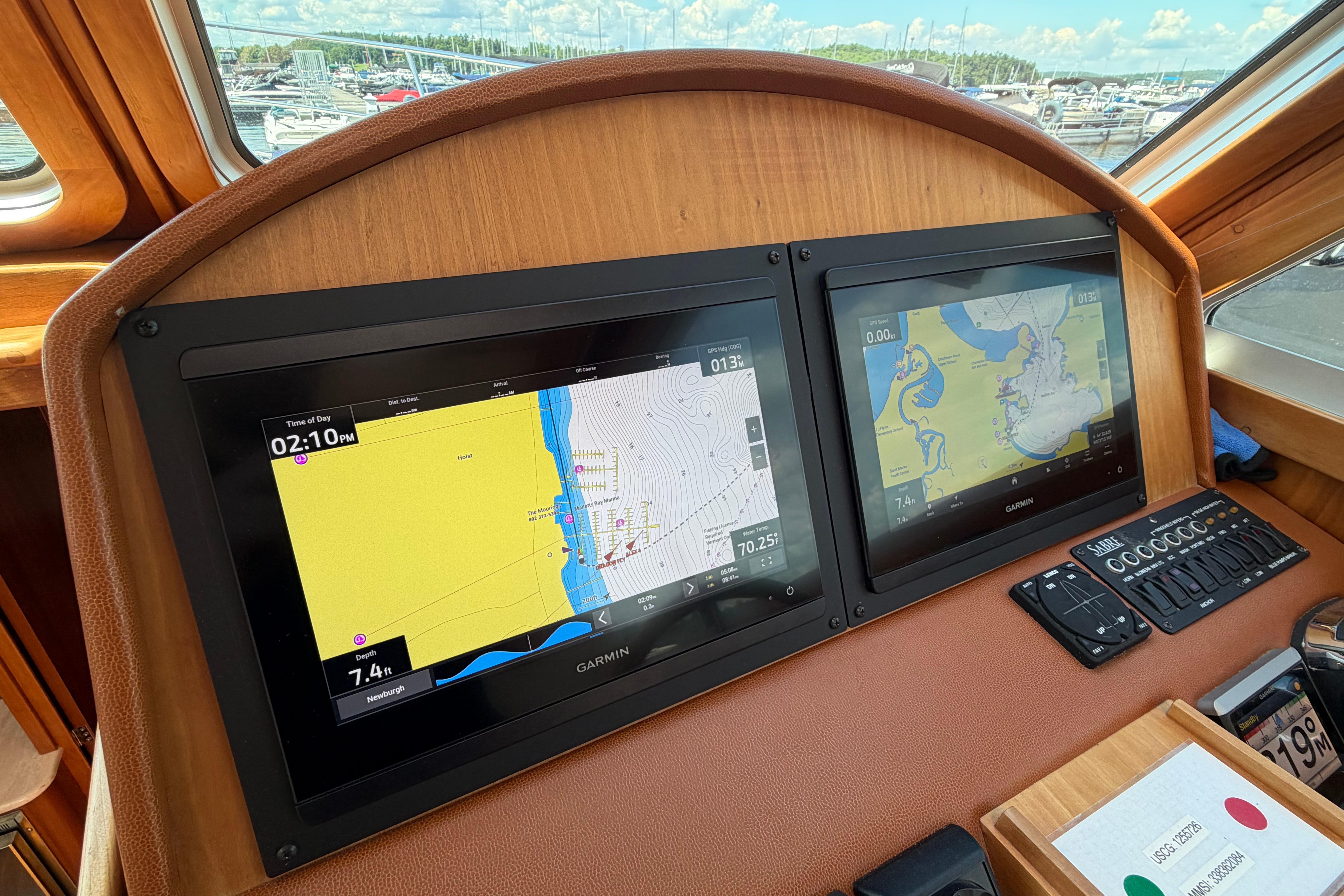 Dashboard of 2015 Sabre 38 Salon Express with dual Garmin navigation screens.