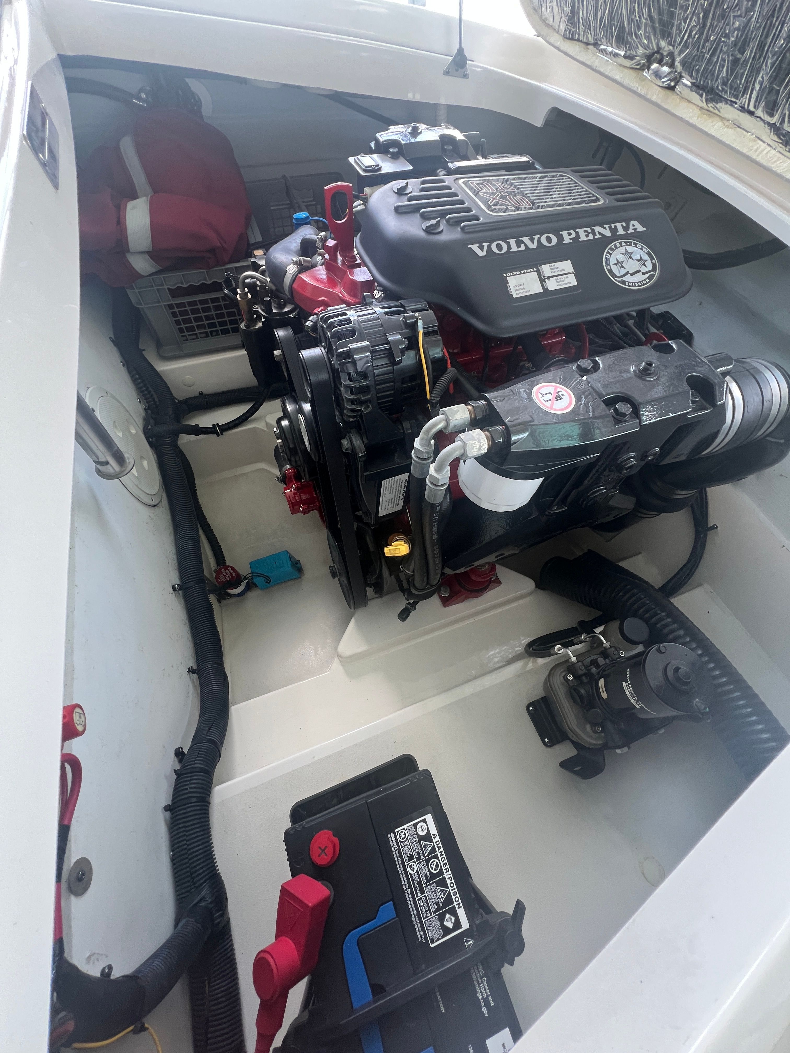 A Volvo Penta engine in a 2006 Chris-Craft Speedster 20. The engine compartment is clean and well-organized.