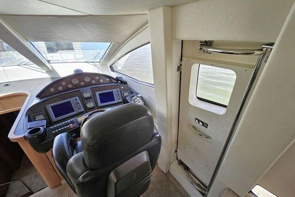 Interior helm of 2005 Sunseeker Manhattan 66 yacht with navigation controls.