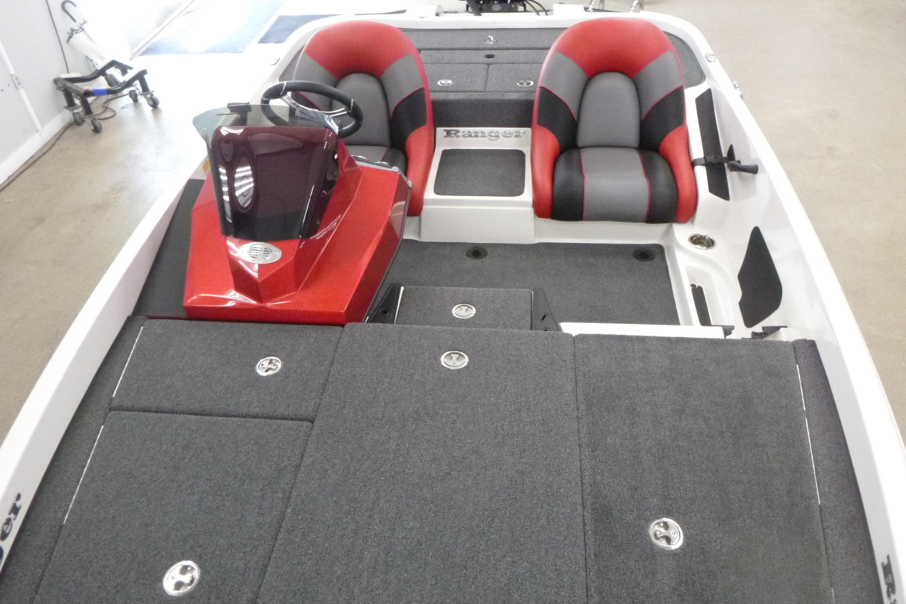 2025 Ranger Z185 boat interior with red and gray seating, steering console, and storage compartments.