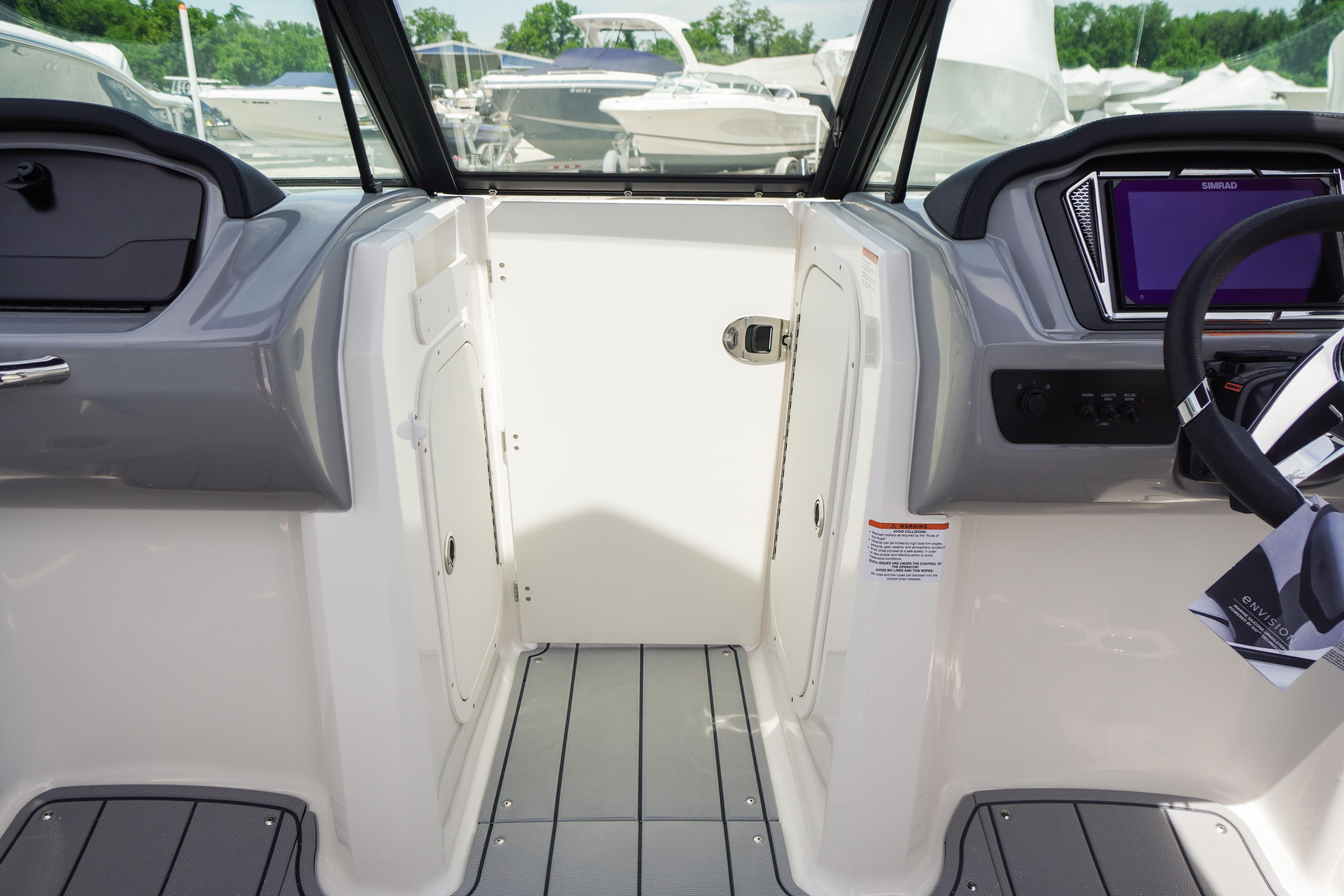 Interior view of 2026 Chaparral 23 SSi OB boat cockpit with modern dashboard and controls.