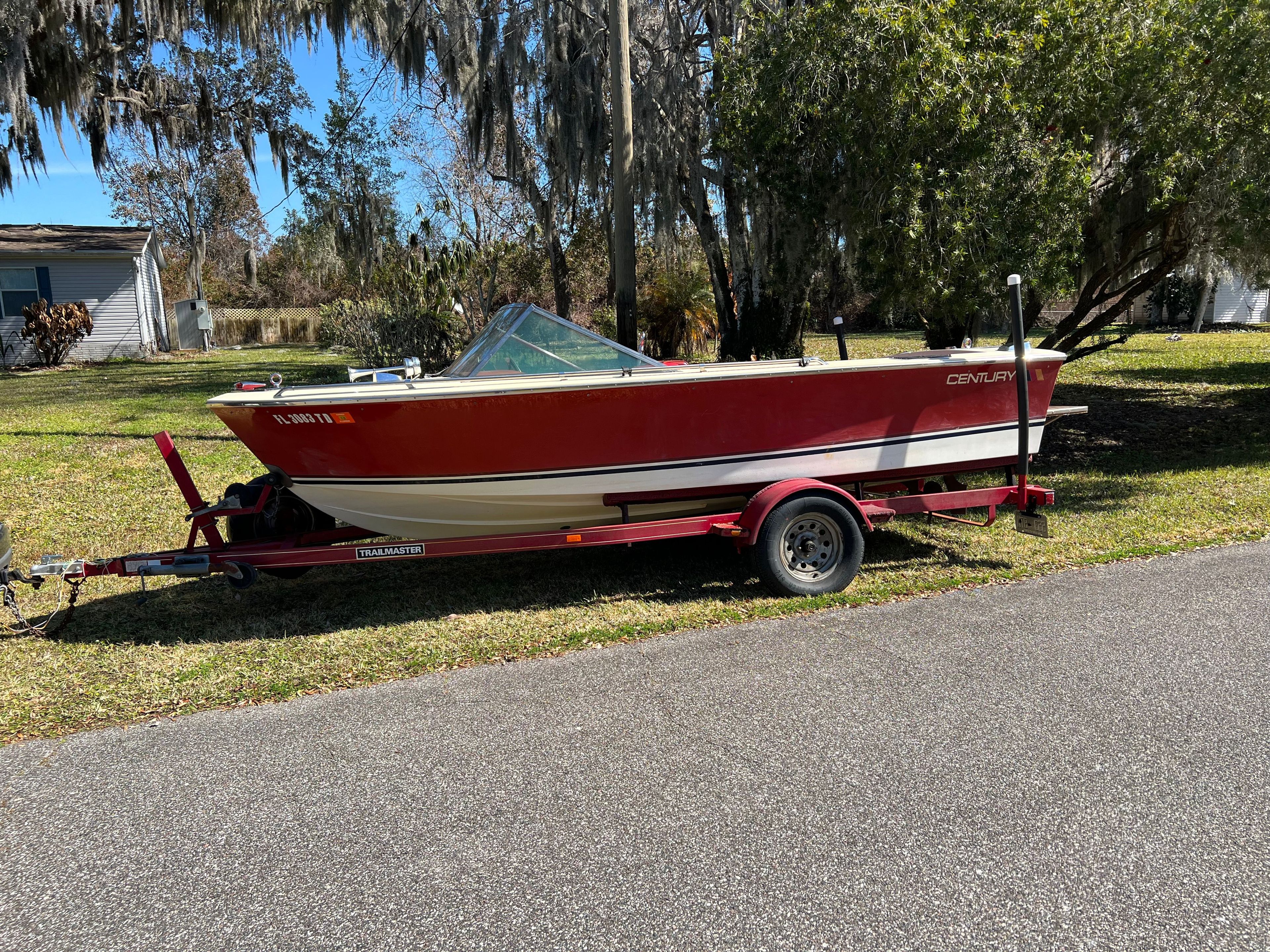 1980 Century Resorter boat parked on a trailer.