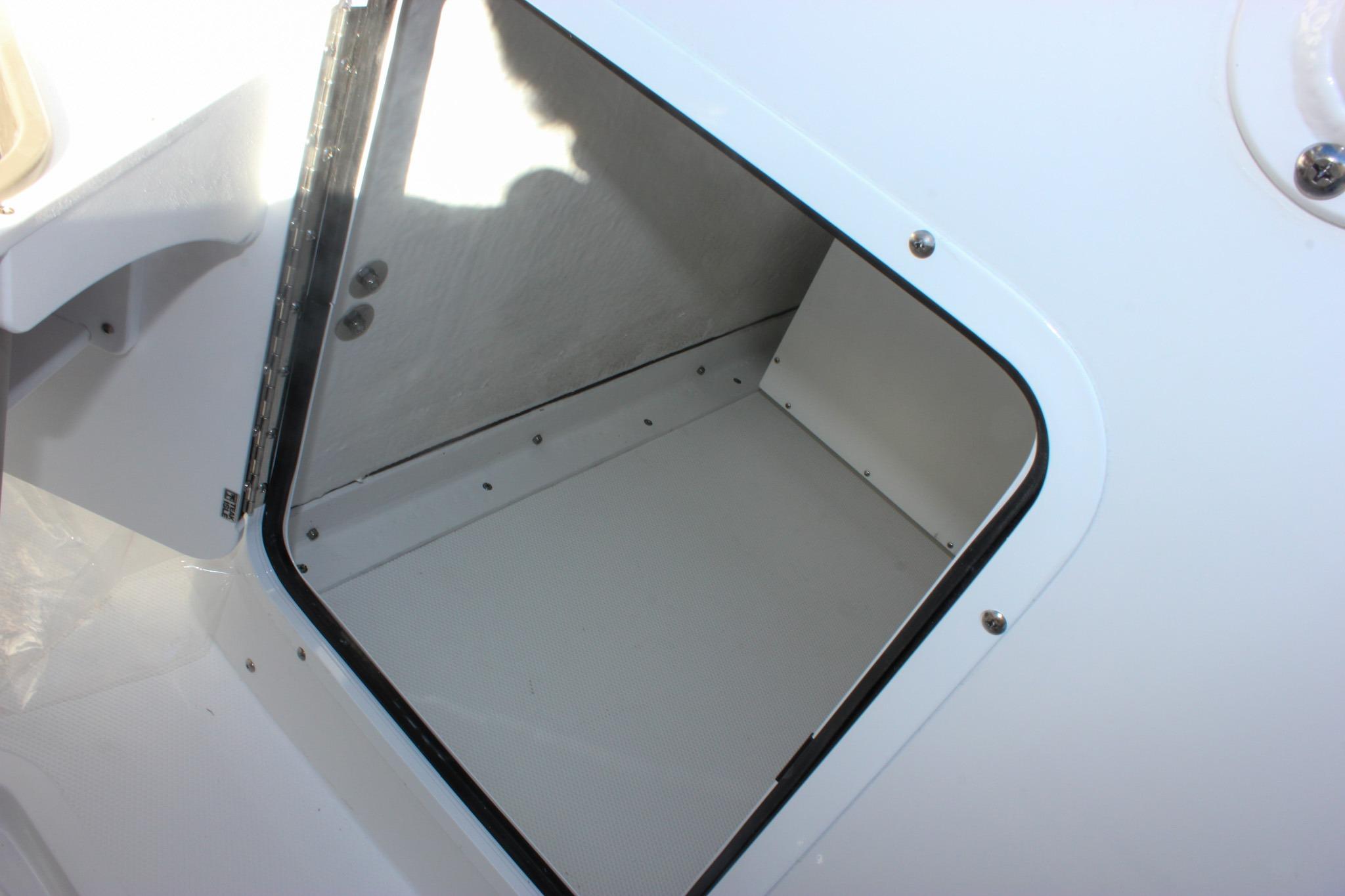 Storage compartment on 2026 Sea Hunt Ultra 285 SE boat.