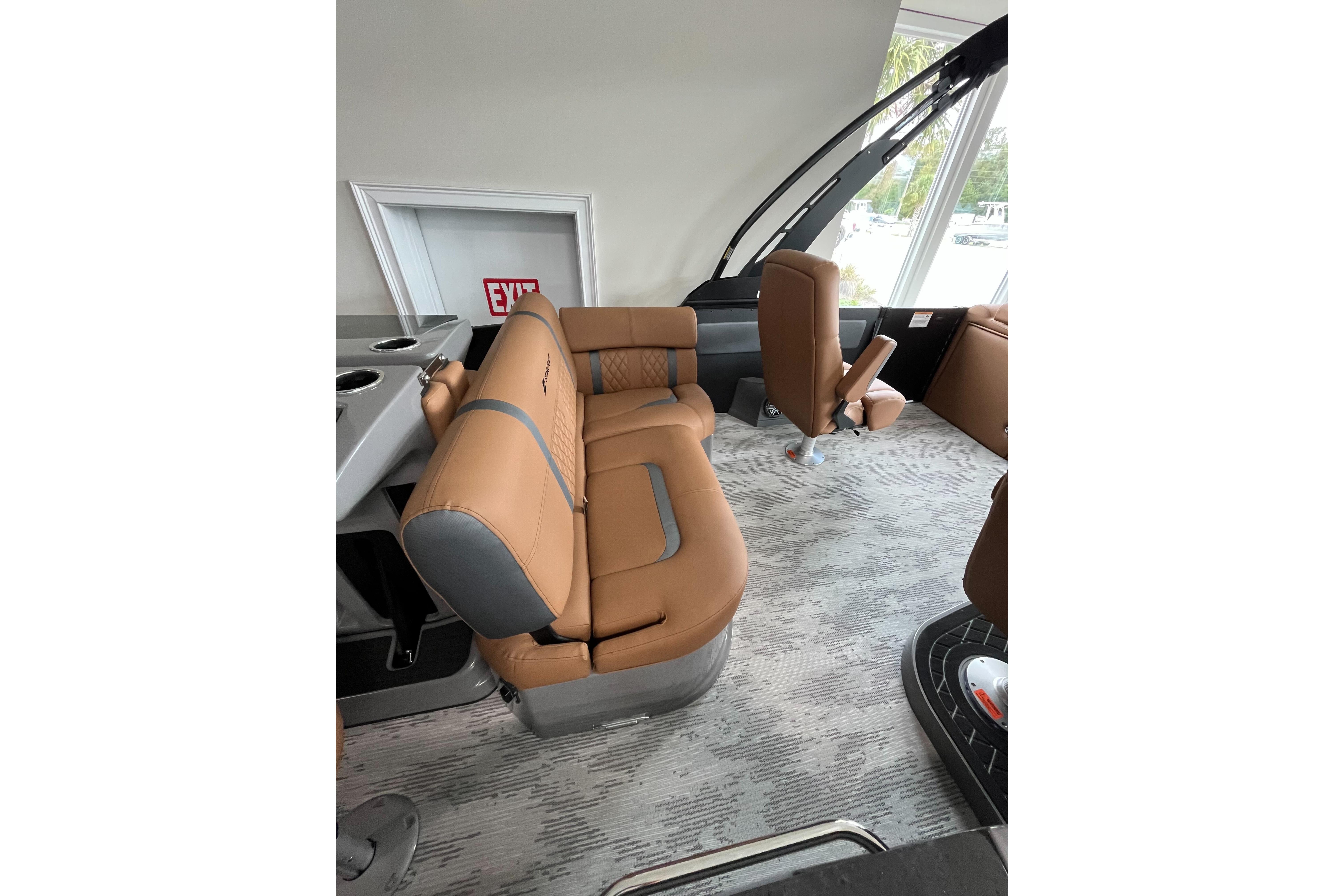 2026 Starcraft RX 25 DL DC boat interior with tan seating and modern design.