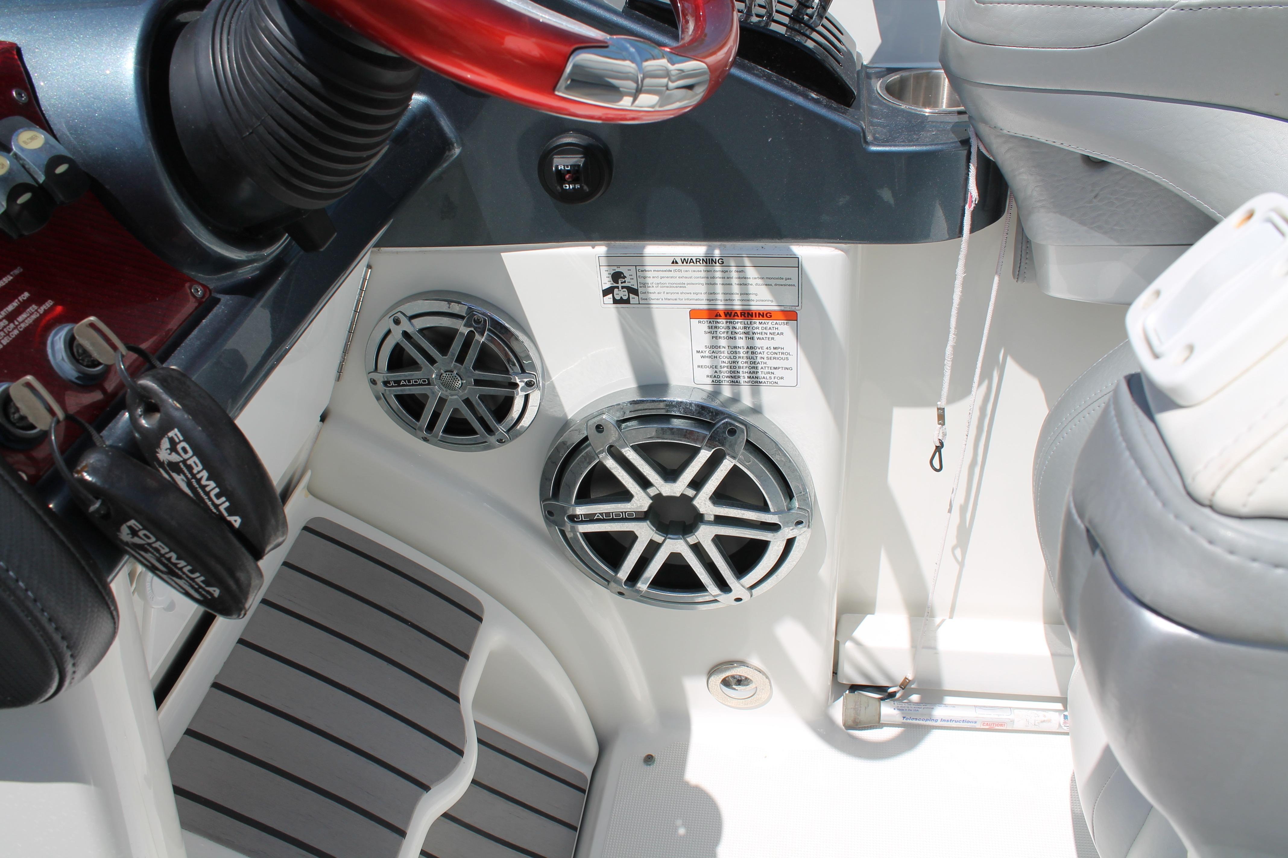 Interior of 2016 Formula 353 FASTech boat with JL Audio speakers and steering wheel.