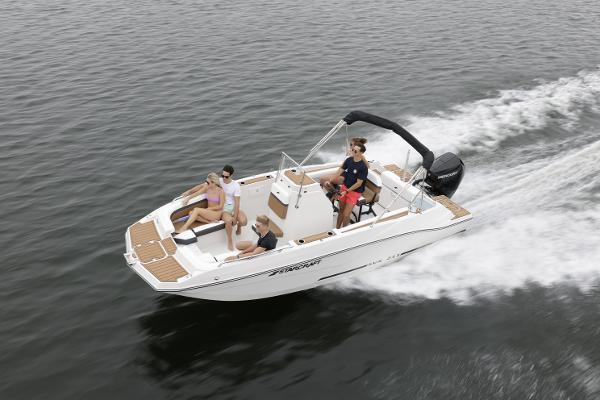 2025 Starcraft SVX 211 OB CC boat cruising with passengers on a calm lake.