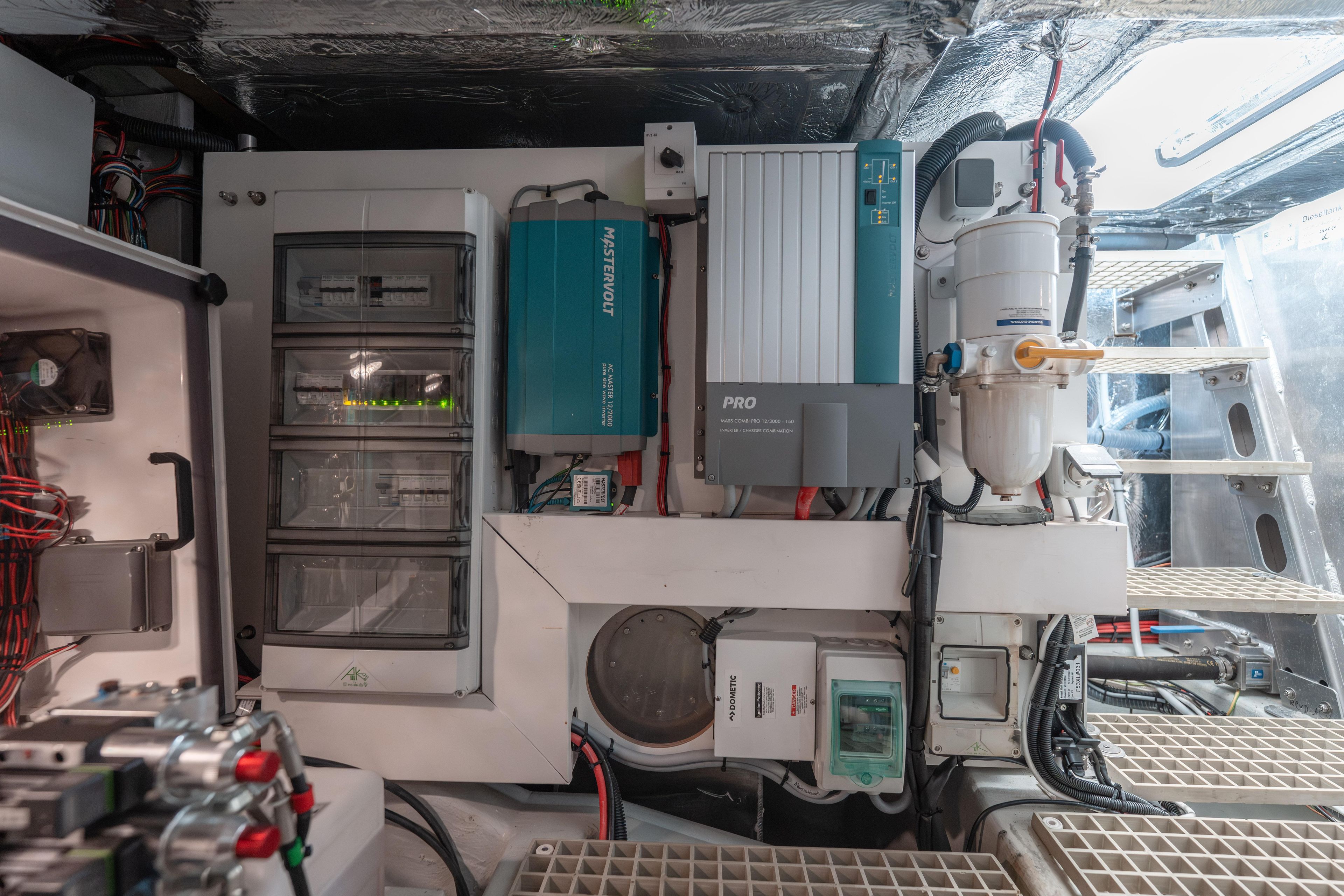 Engine room of 2024 Fjord Boats 53XL, showcasing electrical systems and components.