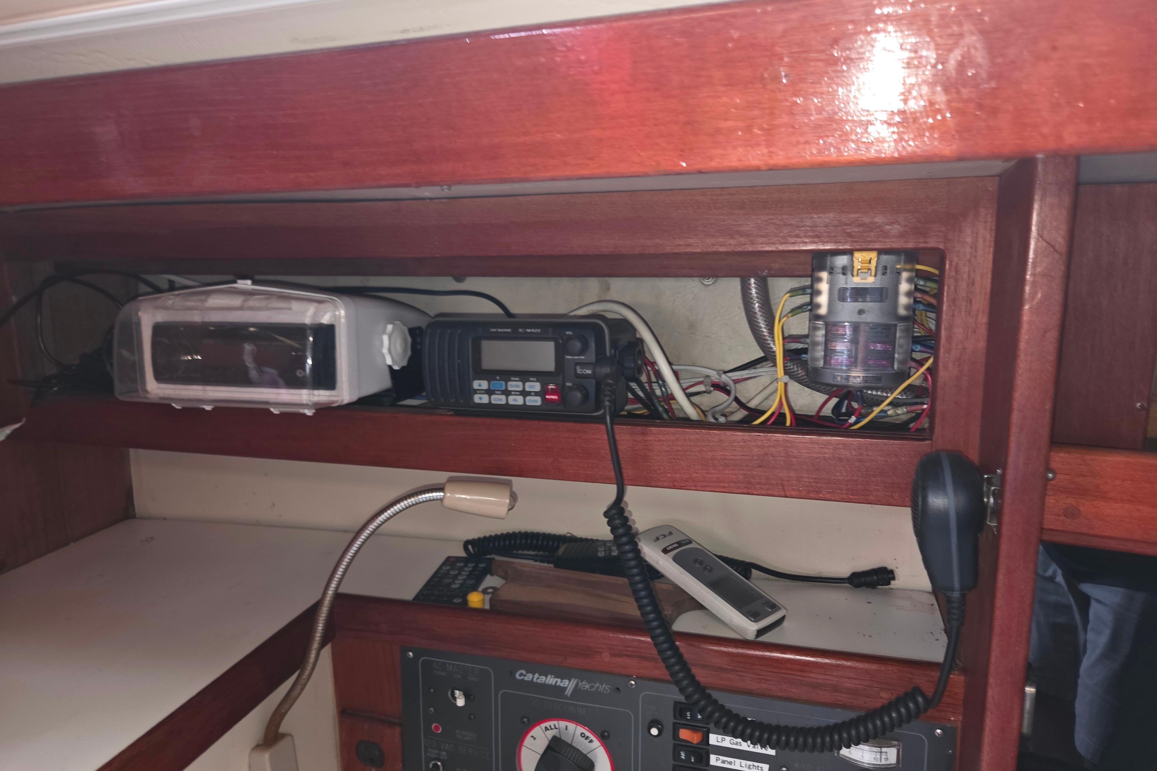 Interior electronics panel of a 1986 Catalina 355 sailboat with communication equipment.