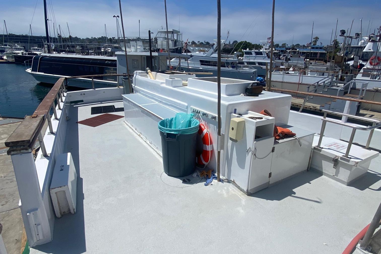 1945 Higgins PT boat docked at marina, featuring deck and equipment.