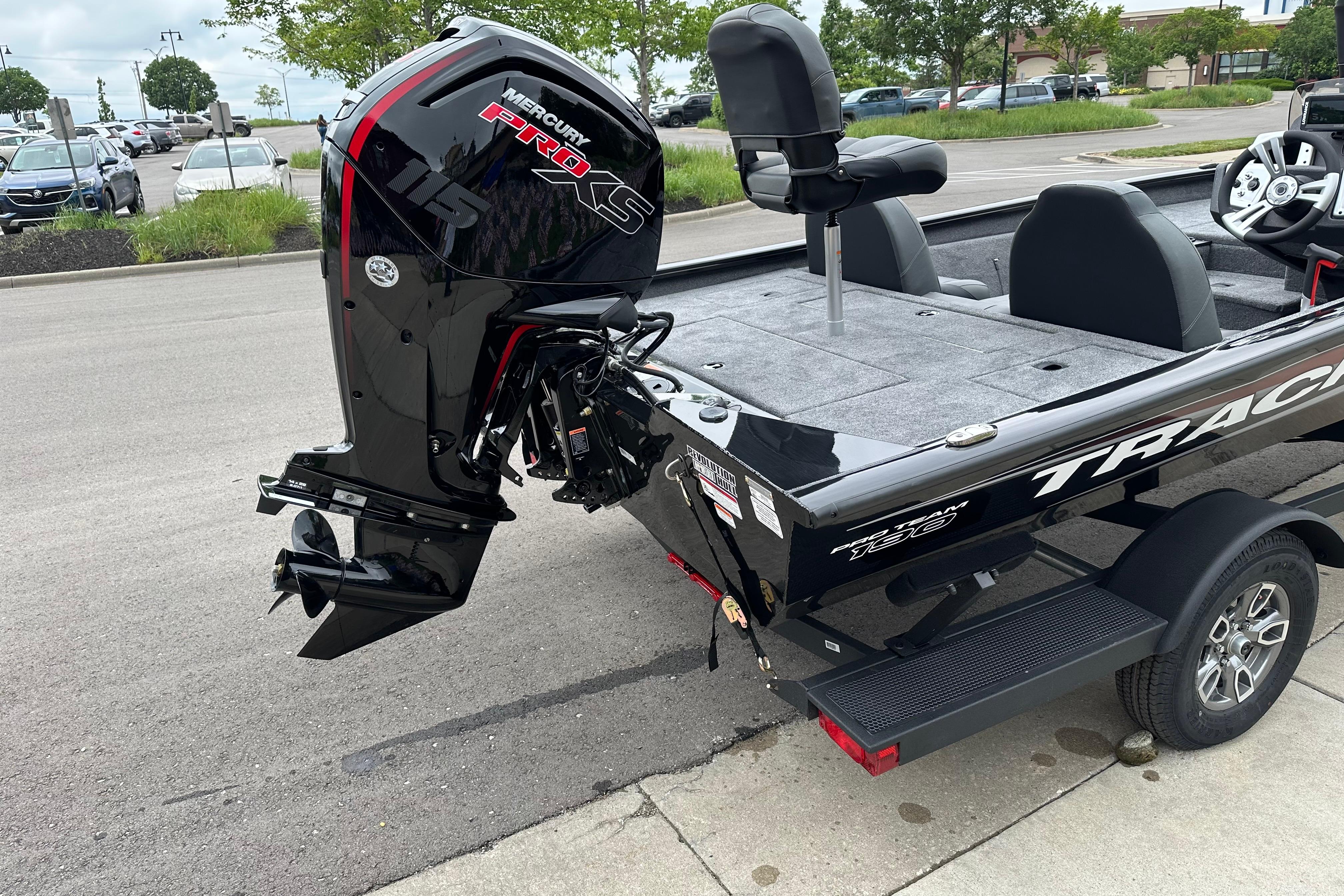 2026 Tracker Pro Team 190 boat with Mercury Pro XS 115 engine, parked outdoors.