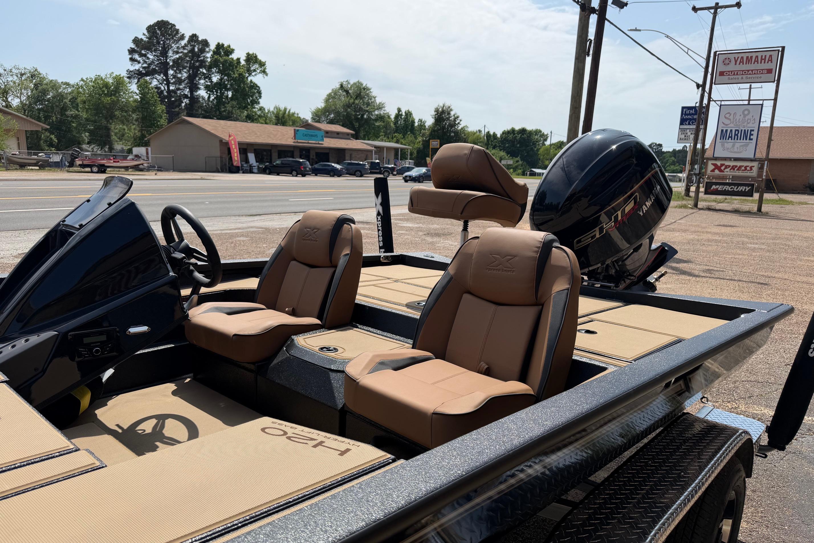 2026 Xpress H20 boat with Yamaha engine, featuring tan seats and sleek design.