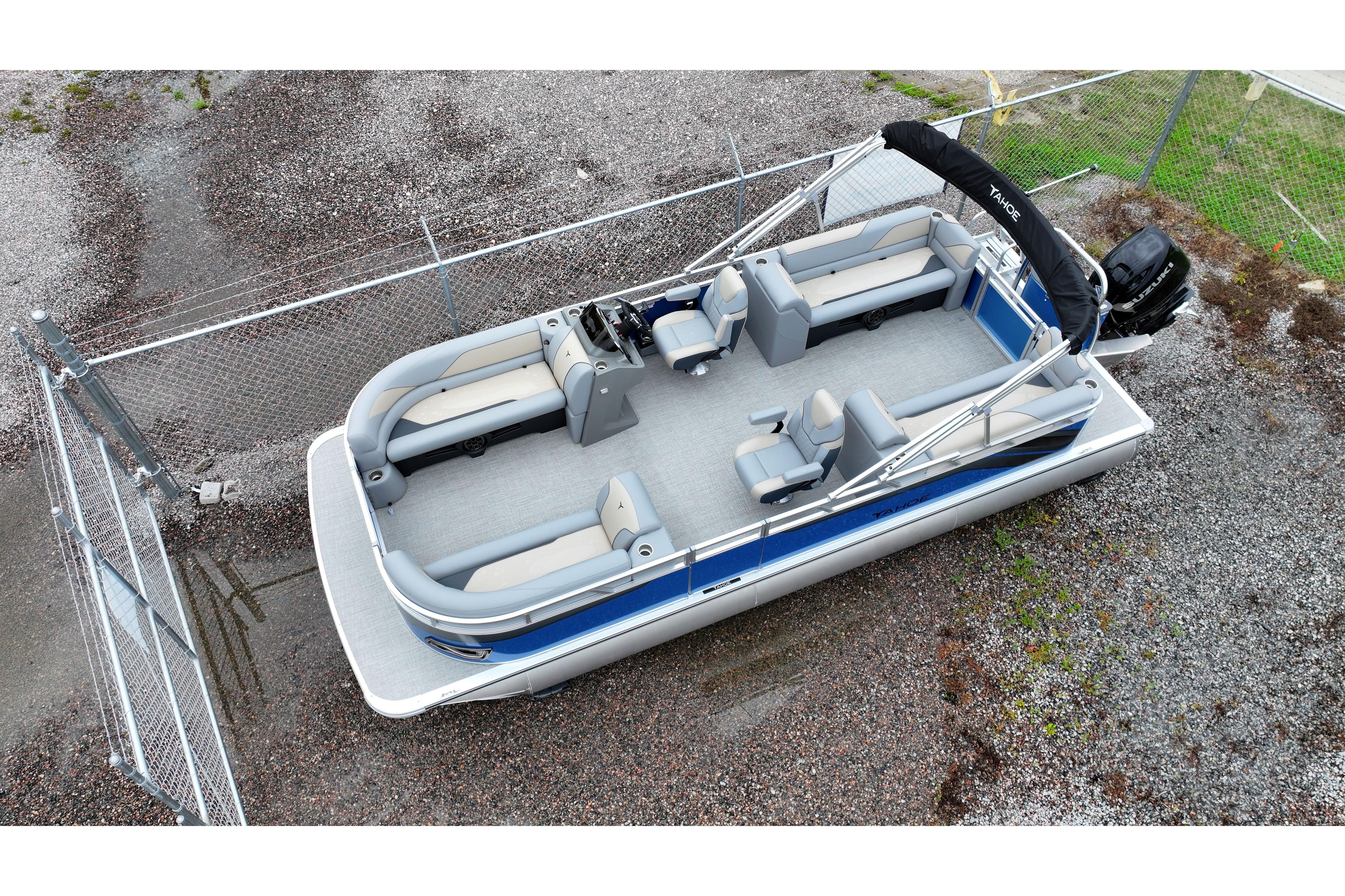 2026 Tahoe Pontoon Sport 85 Quad Lounger, aerial view, parked on gravel.