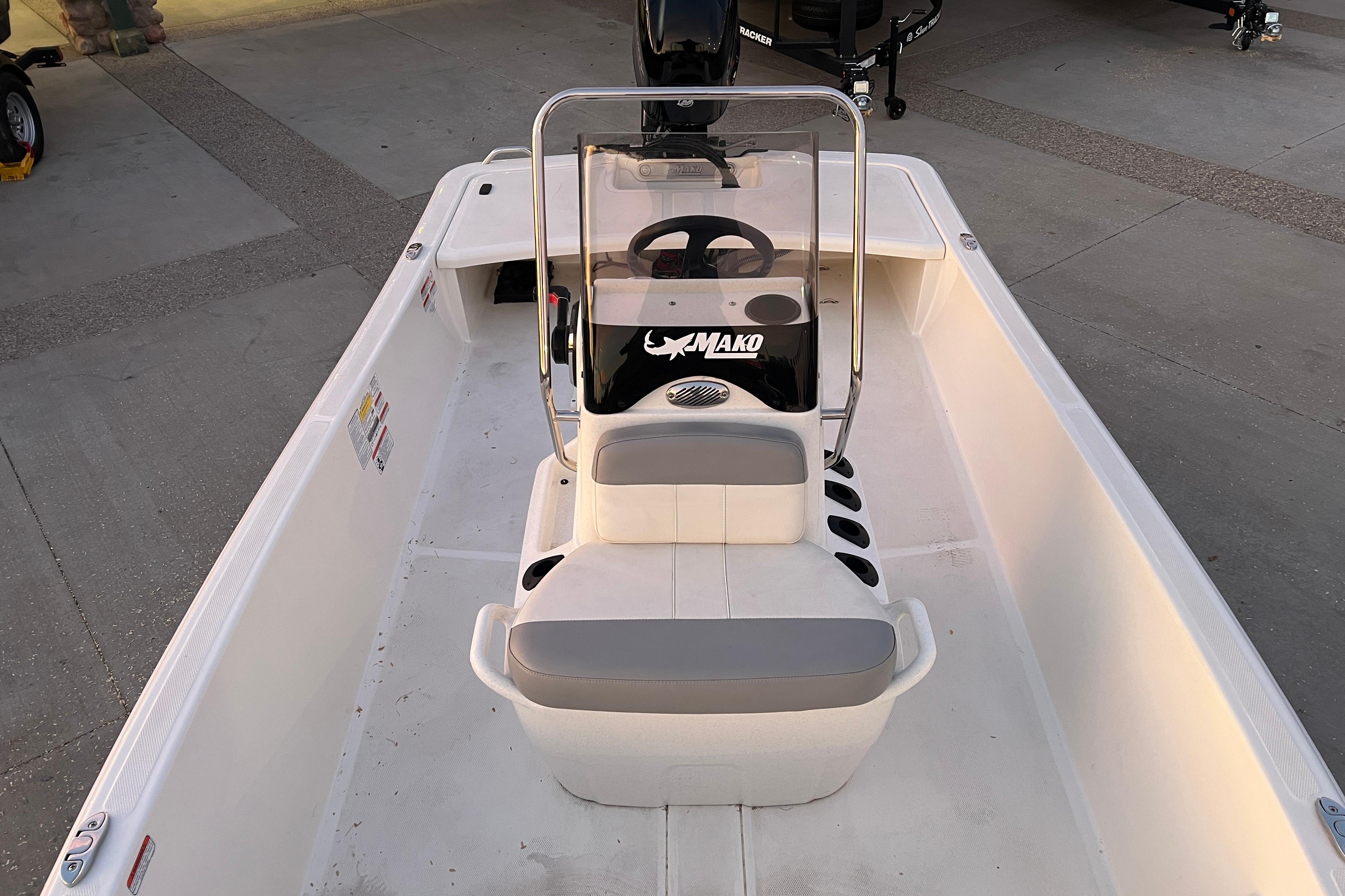2025 Mako Pro Skiff 15 CC boat interior with steering console and seating.