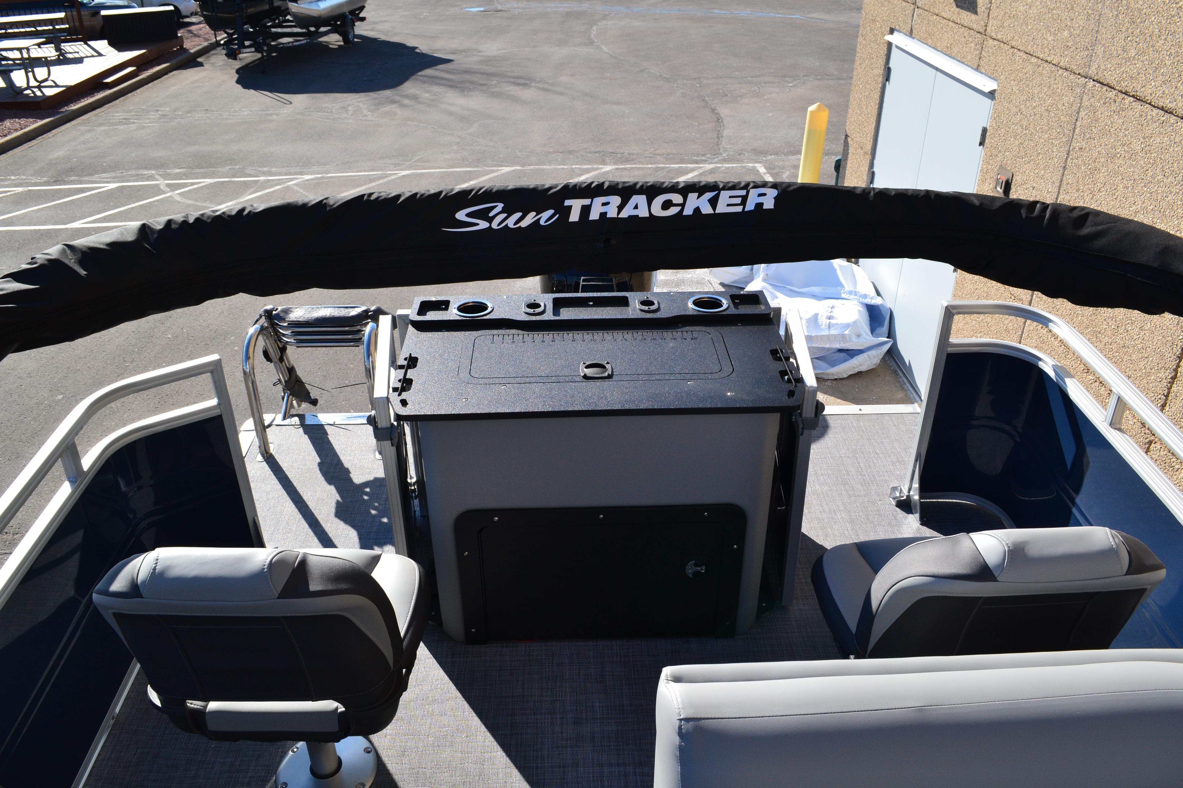 2026 Sun Tracker SportFish 22 XP3 boat interior with seating and control panel.