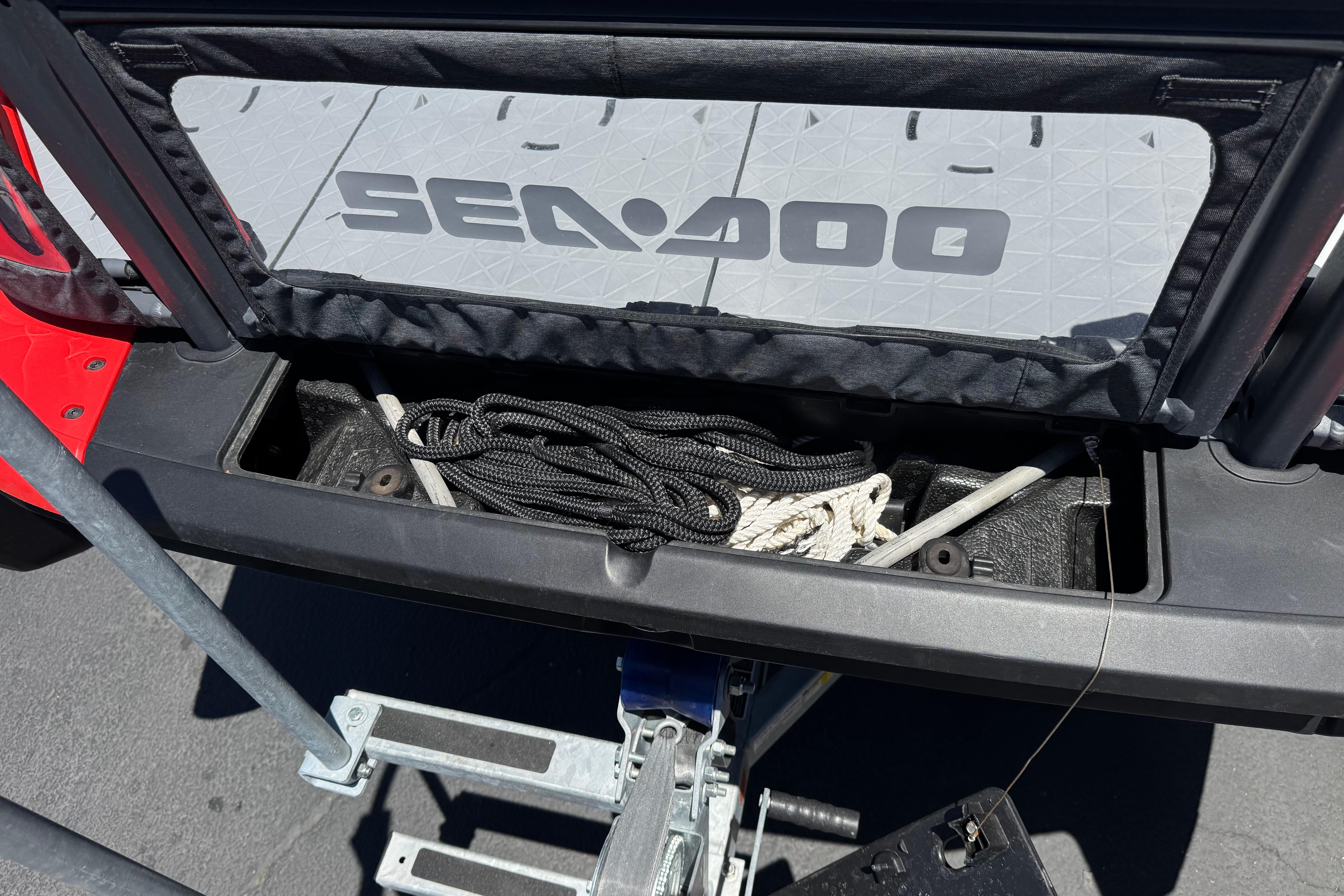 2024 Sea-Doo Switch Compact storage compartment with ropes and accessories.