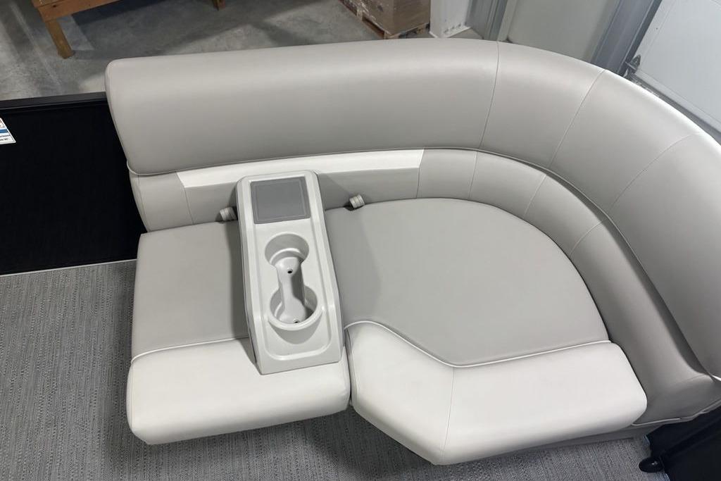 2026 Godfrey Xperience 2086 SFLX boat seating with cup holder, featuring sleek gray upholstery.