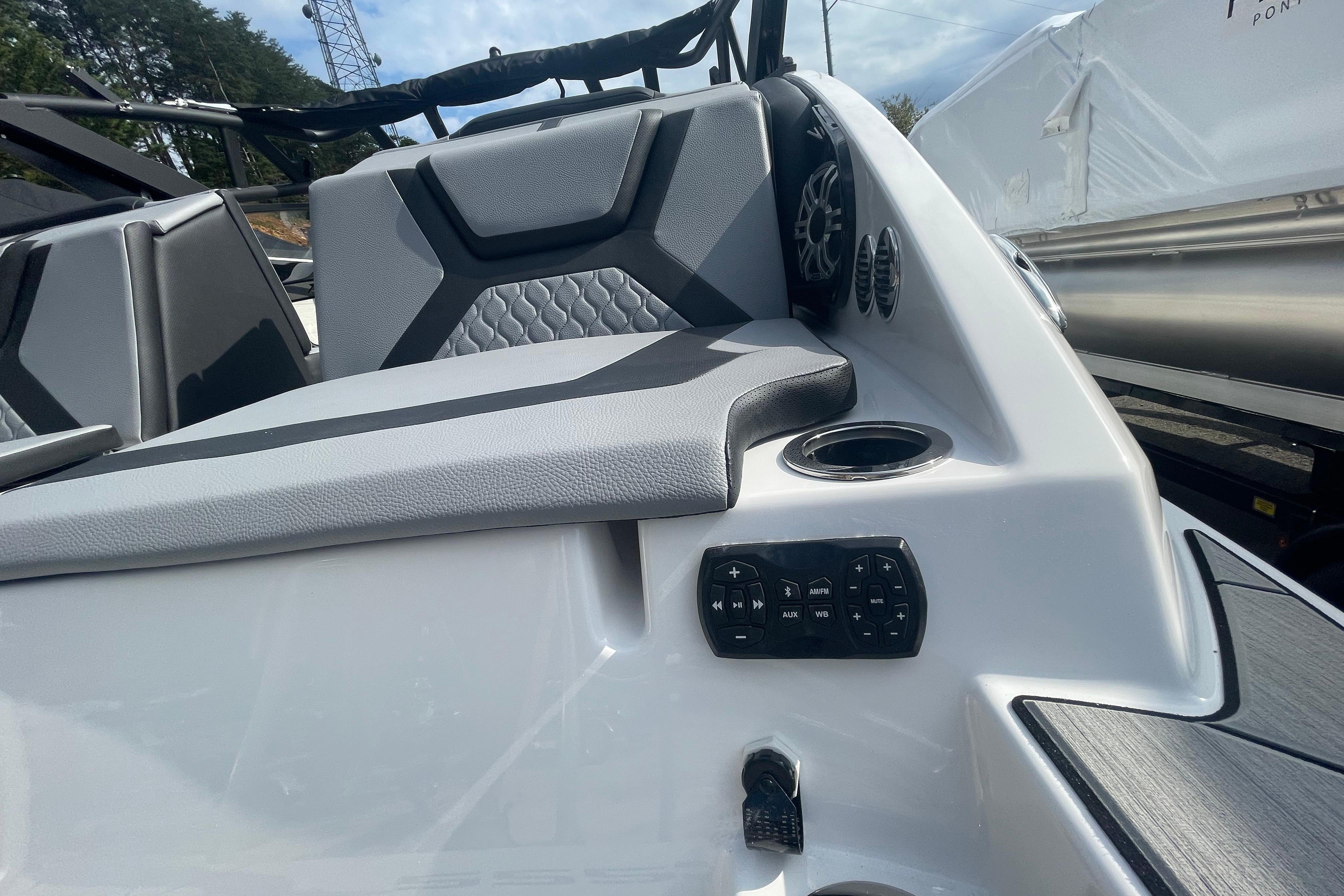 2026 Yamaha Boats 222XD interior with seating, speaker, and control panel.