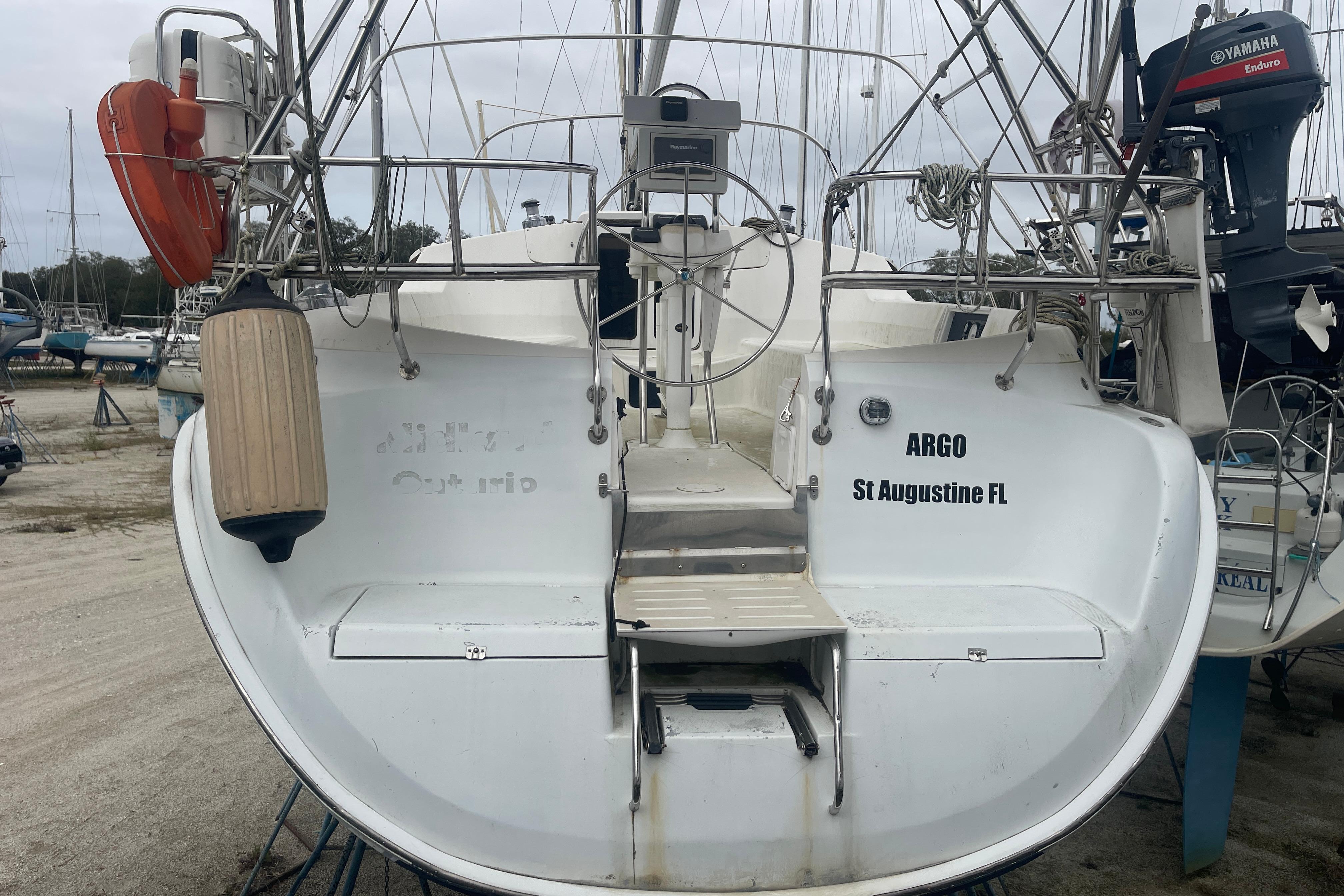 2004 Hunter 44 Deck Salon sailboat, rear view, docked with equipment visible.