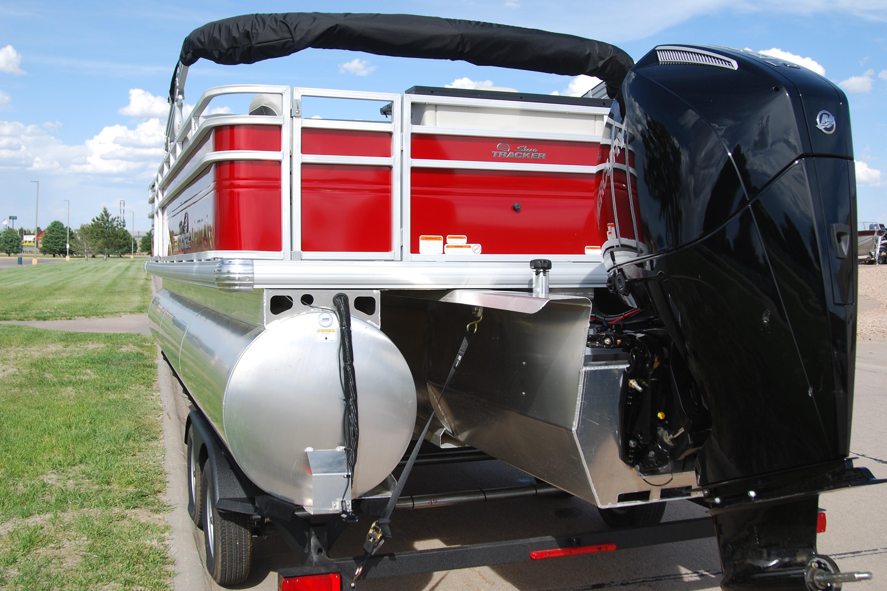2026 Sun Tracker Fishin' Barge 22 XP3 pontoon boat with powerful outboard motor.