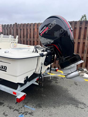 2025 Mako Pro Skiff 19 CC boat with powerful outboard motor, parked on a trailer.