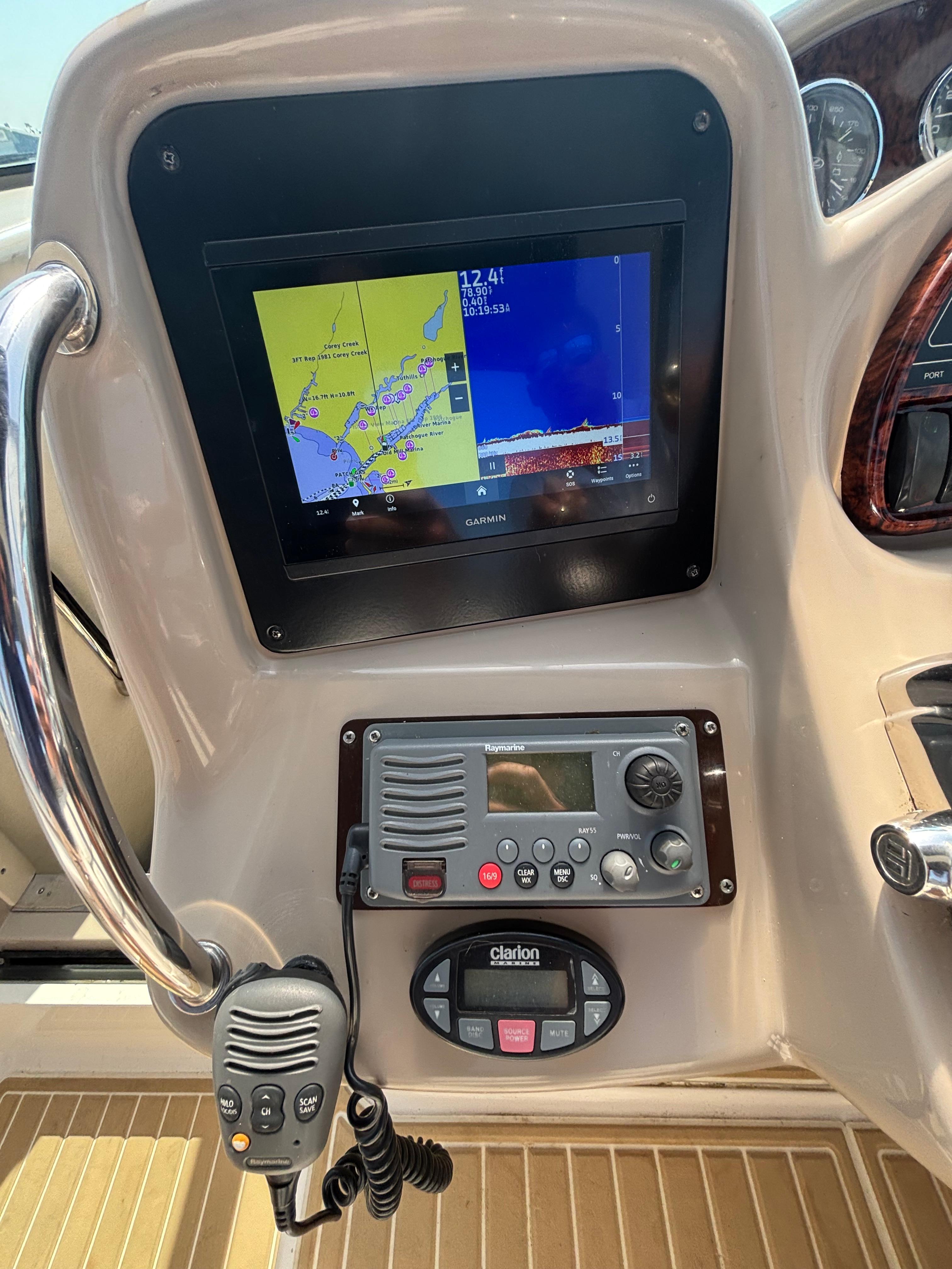 Dashboard of 2004 Sea Ray 320 Sundancer with Garmin navigation and communication equipment.