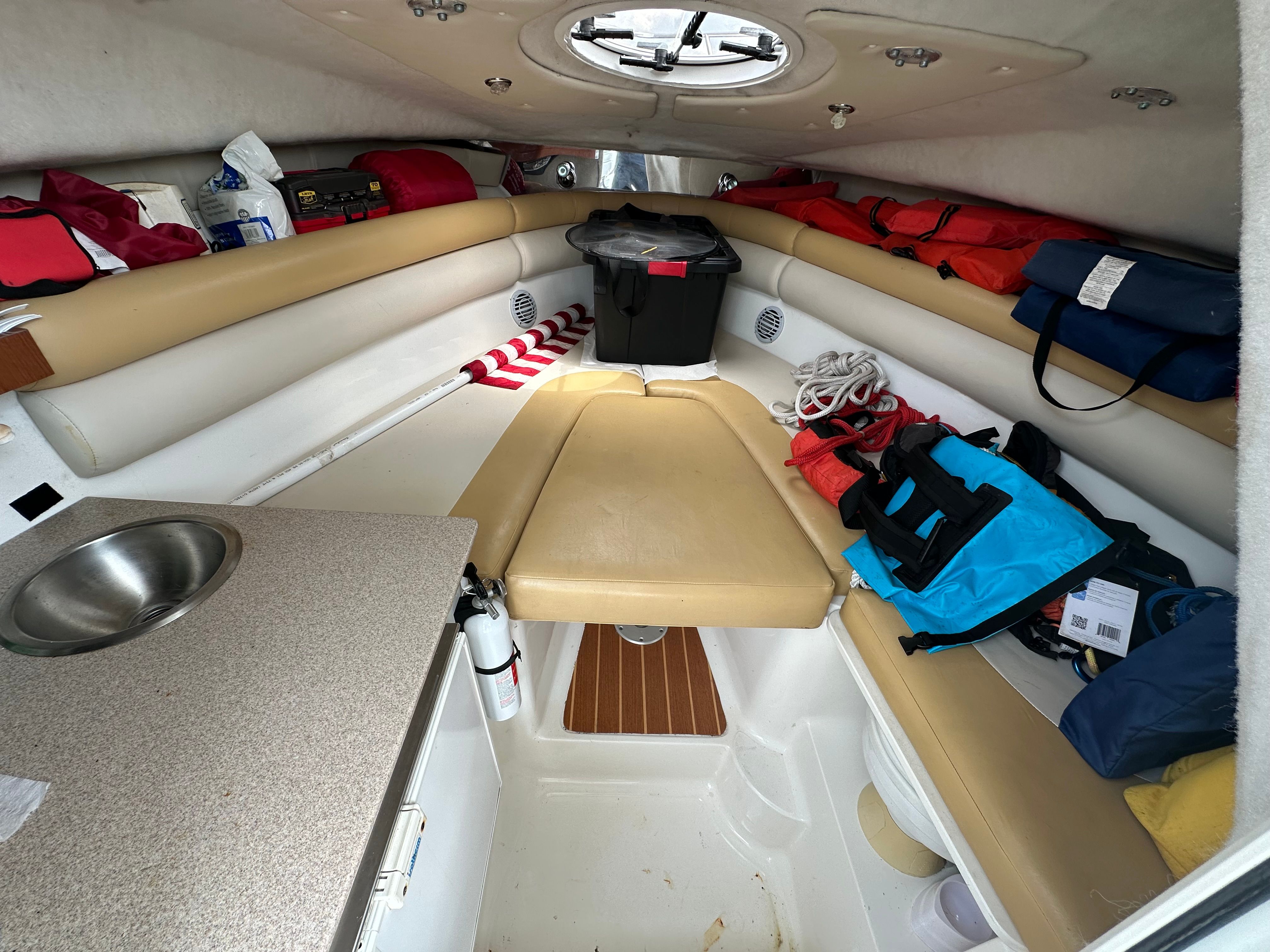 Interior of a 2009 Sea Fox 256WA with seating and storage space.