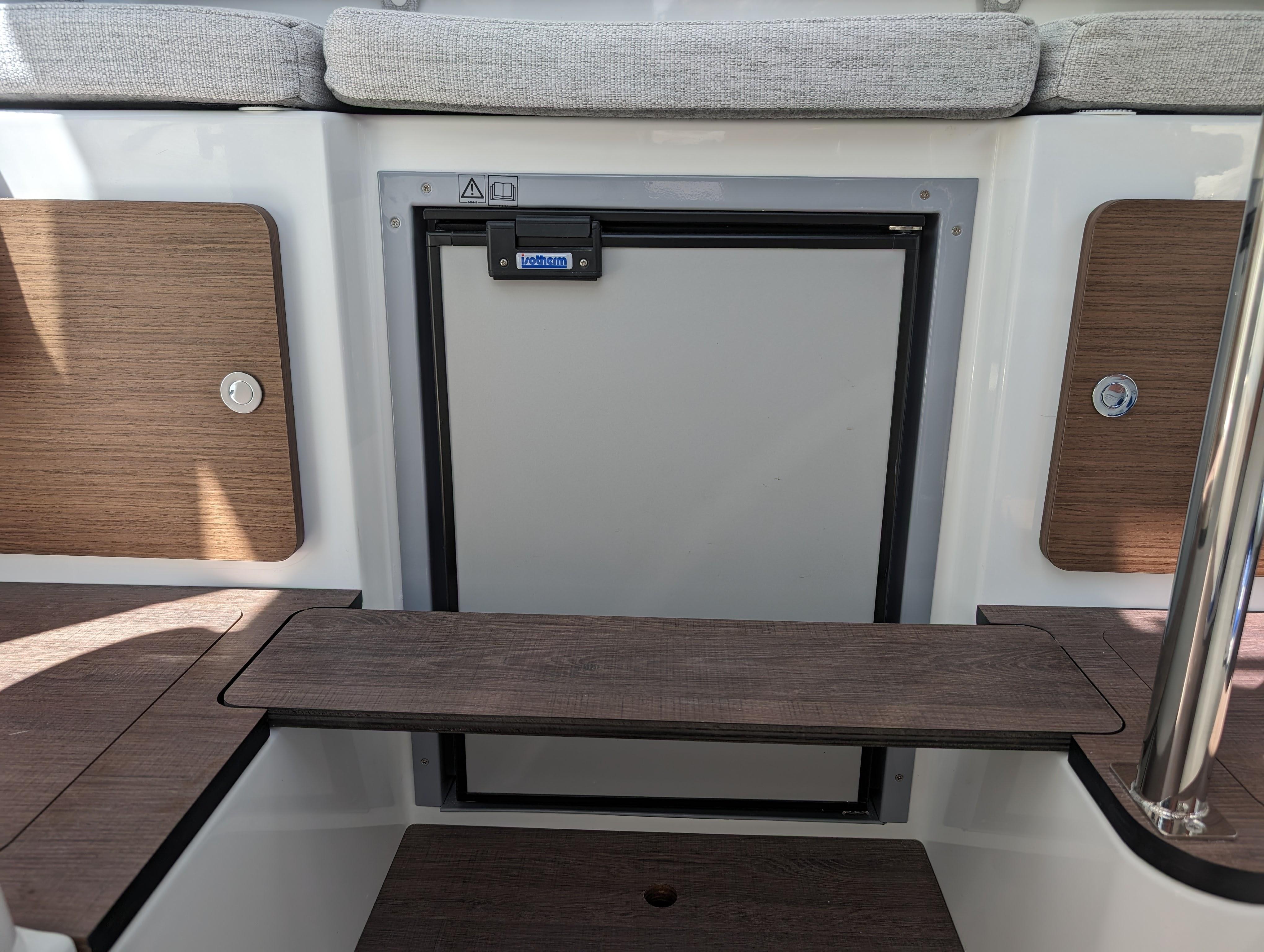 2024 Jeanneau NC Sport 795 Series 2 interior with wooden accents and seating.