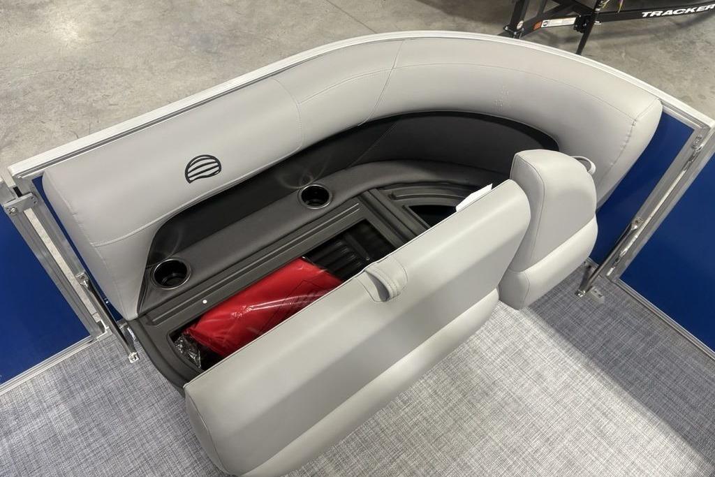 2026 Sun Tracker Party Barge 16 DLX seating with storage and cup holders.