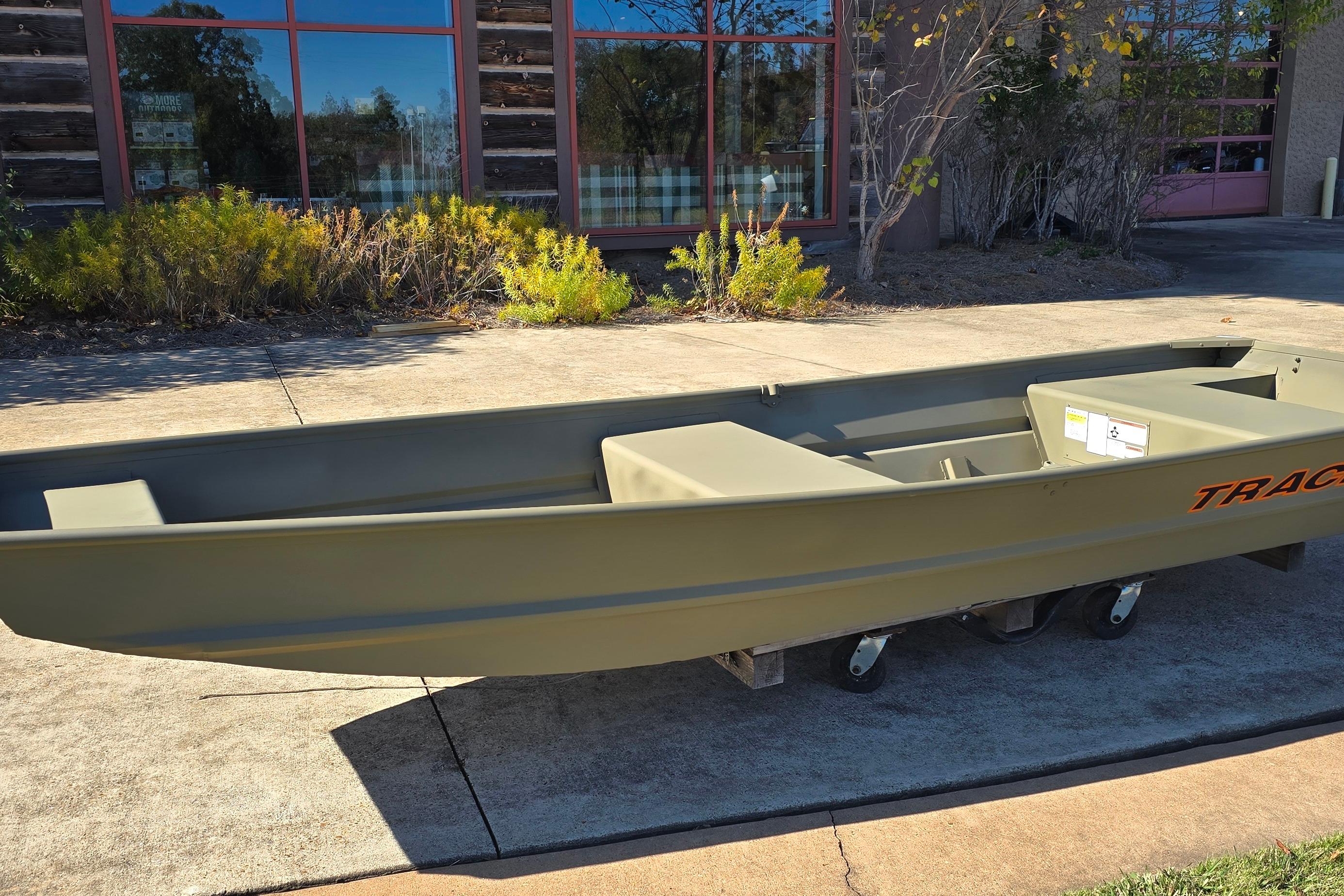 2026 Tracker Grizzly 14 Jon boat displayed outdoors on a sunny day.