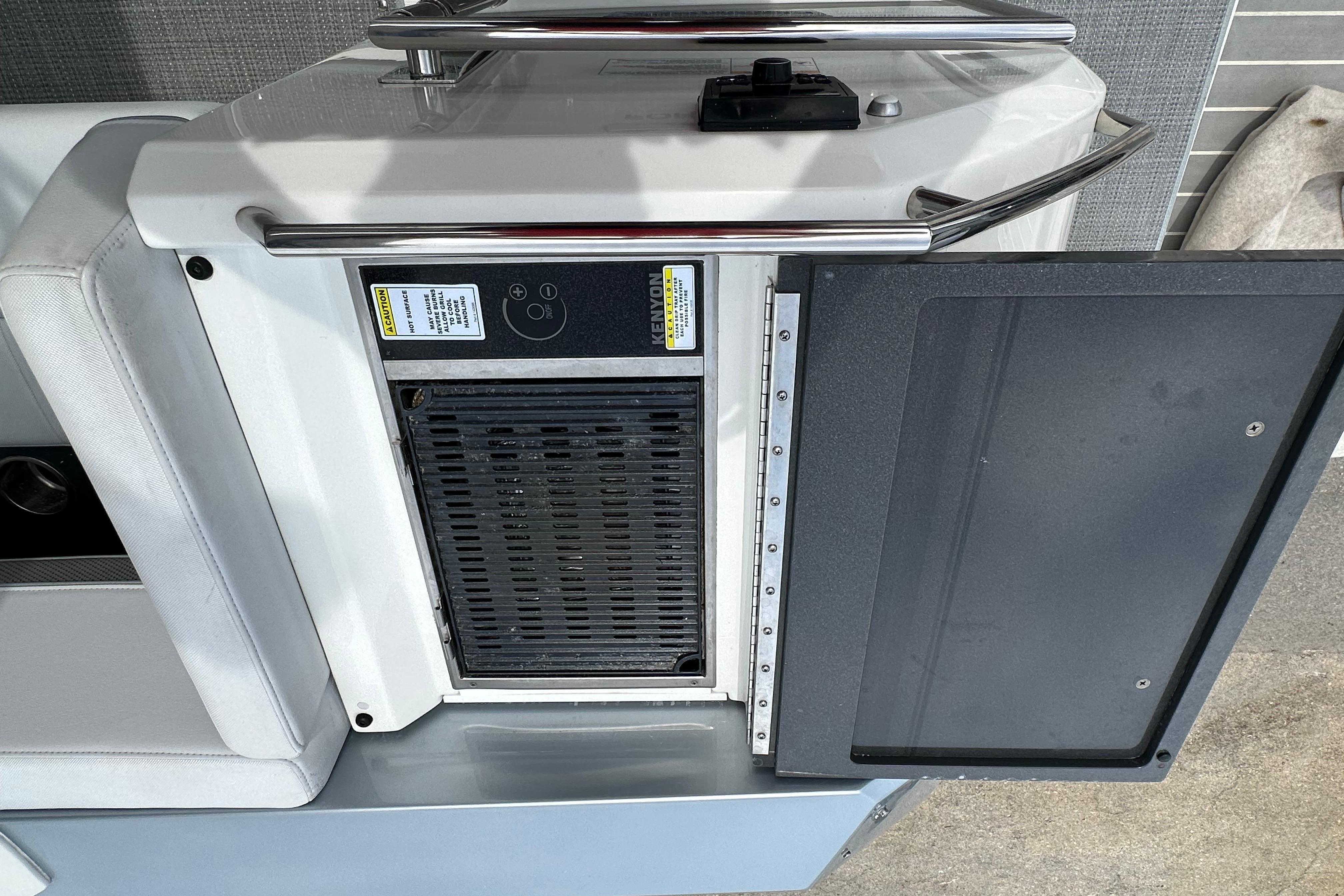 Open storage compartment on a 2021 Formula 380 Super Sport Crossover OB boat.