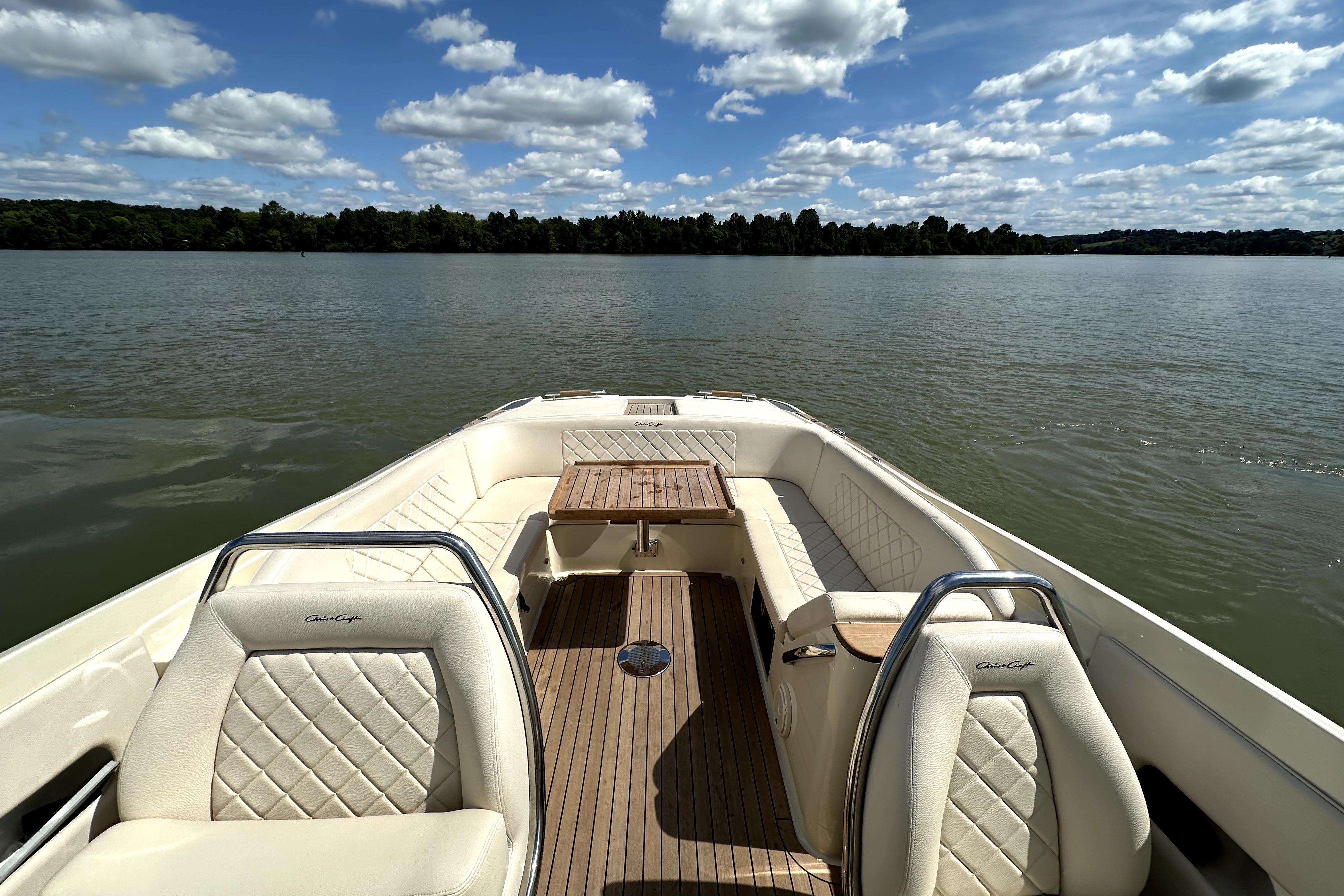 2019 Chris-Craft Launch 30 boat interior with elegant seating on a serene lake.