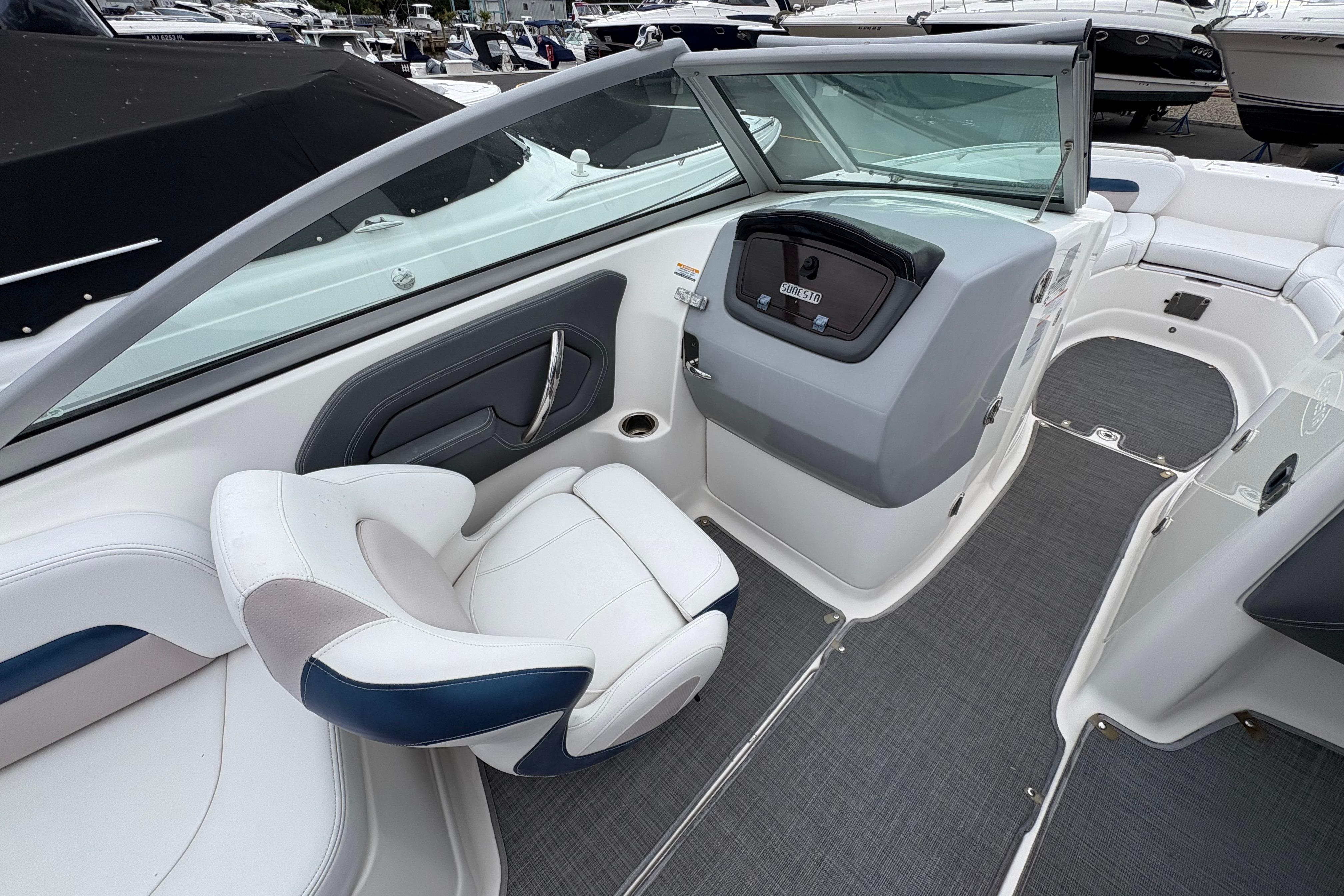 2015 Chaparral 264 Sunesta boat interior with helm and seating area.