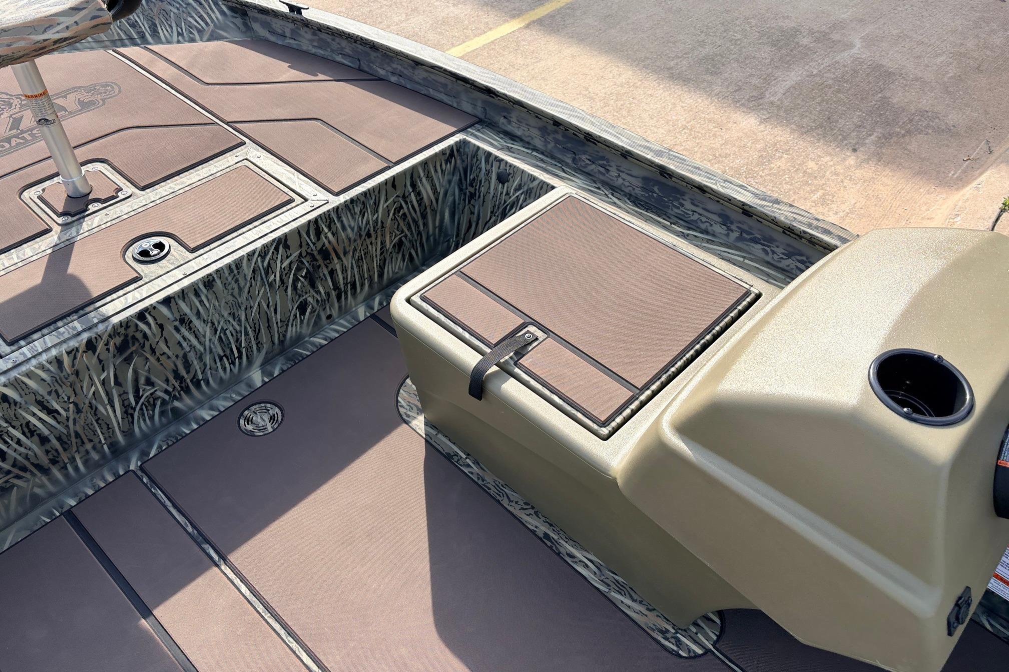 2026 Tracker Grizzly 1754 SC boat interior with camo design and storage compartments.