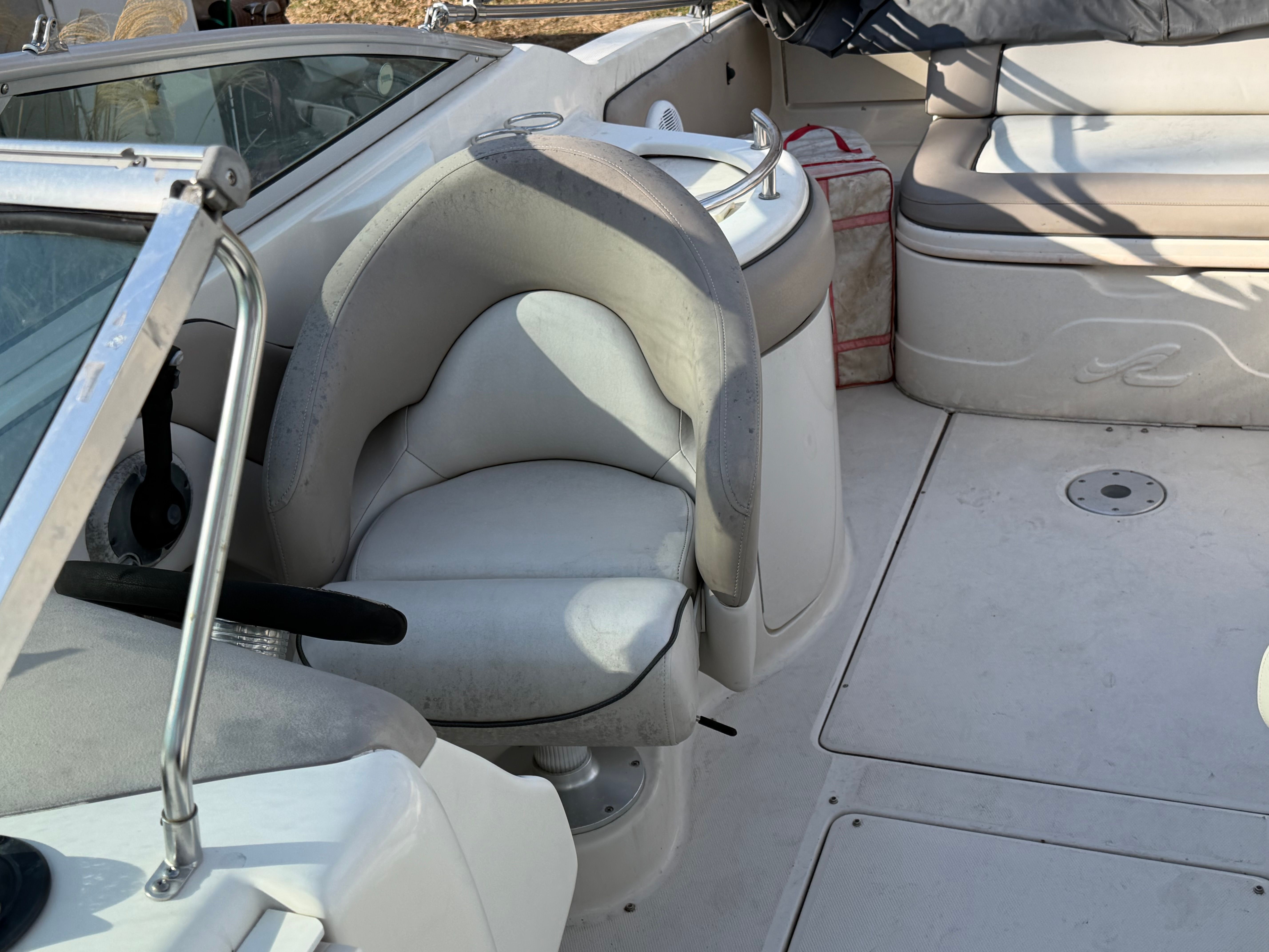 Interior of a 2004 Sea Ray 270 Sundeck boat with seating area.