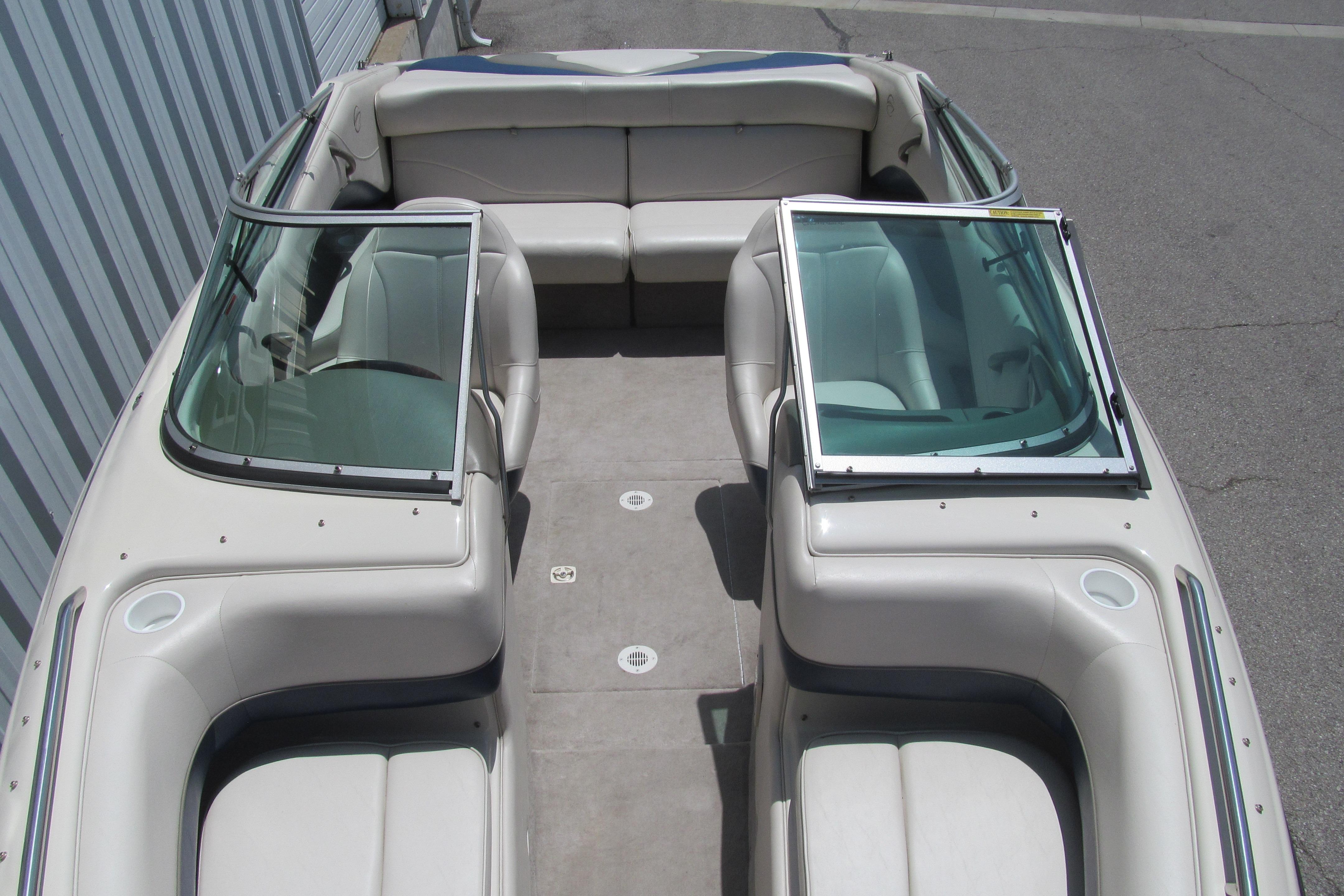2001 Crownline 225 BR boat interior with spacious seating and dual windshields.