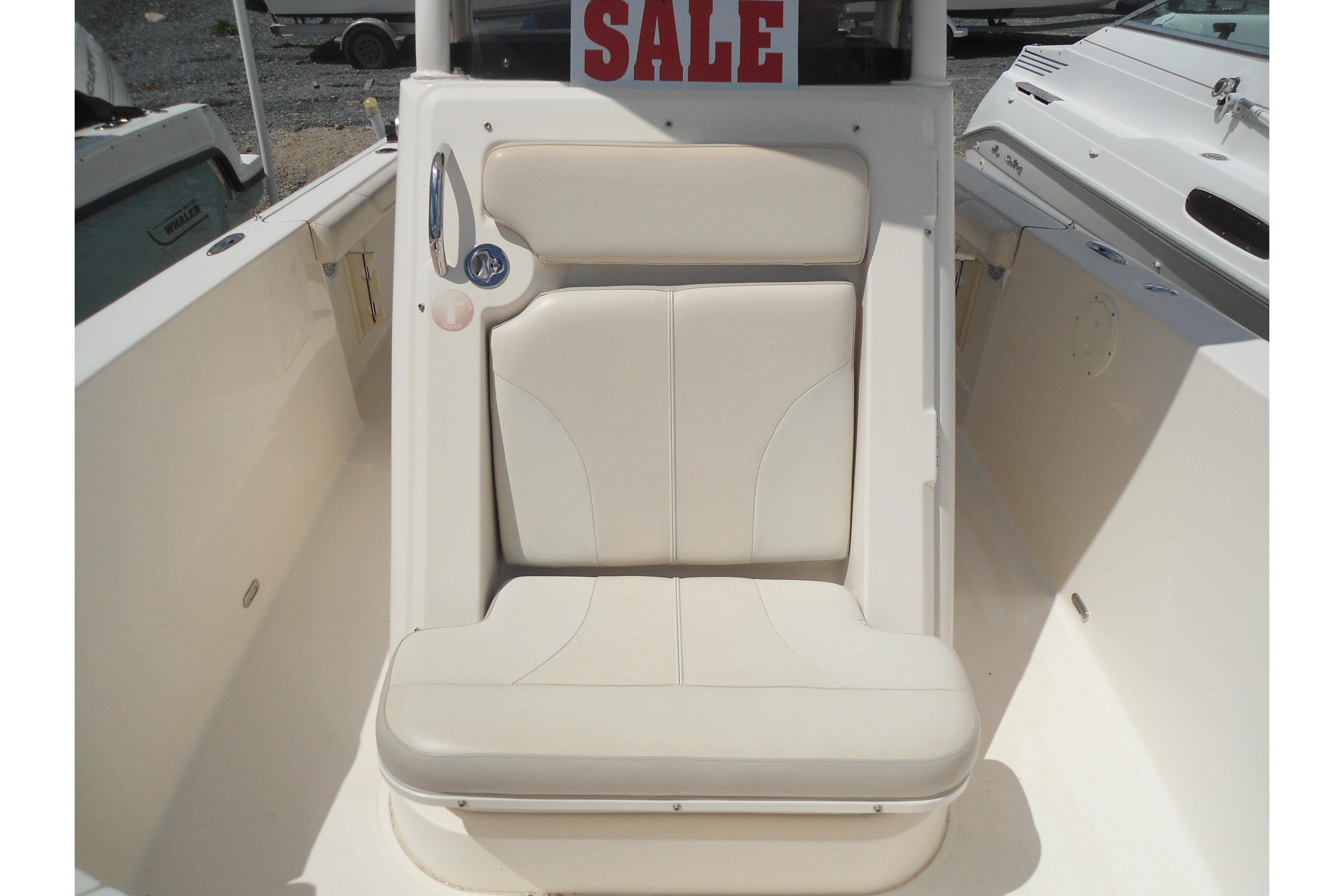 2013 Pursuit C 260 Center Console boat seat with "For Sale" sign.