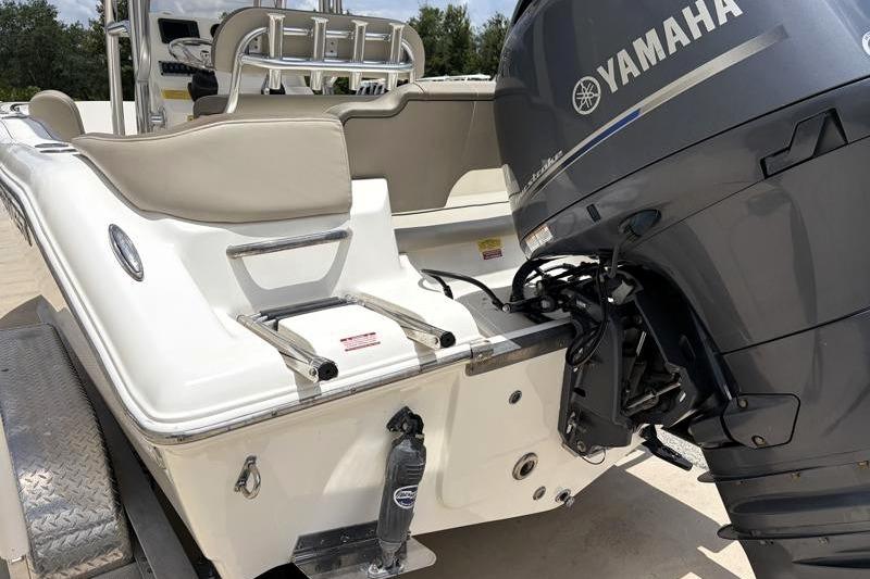 2023 Key West 203 FS boat with Yamaha outboard motor, rear view.