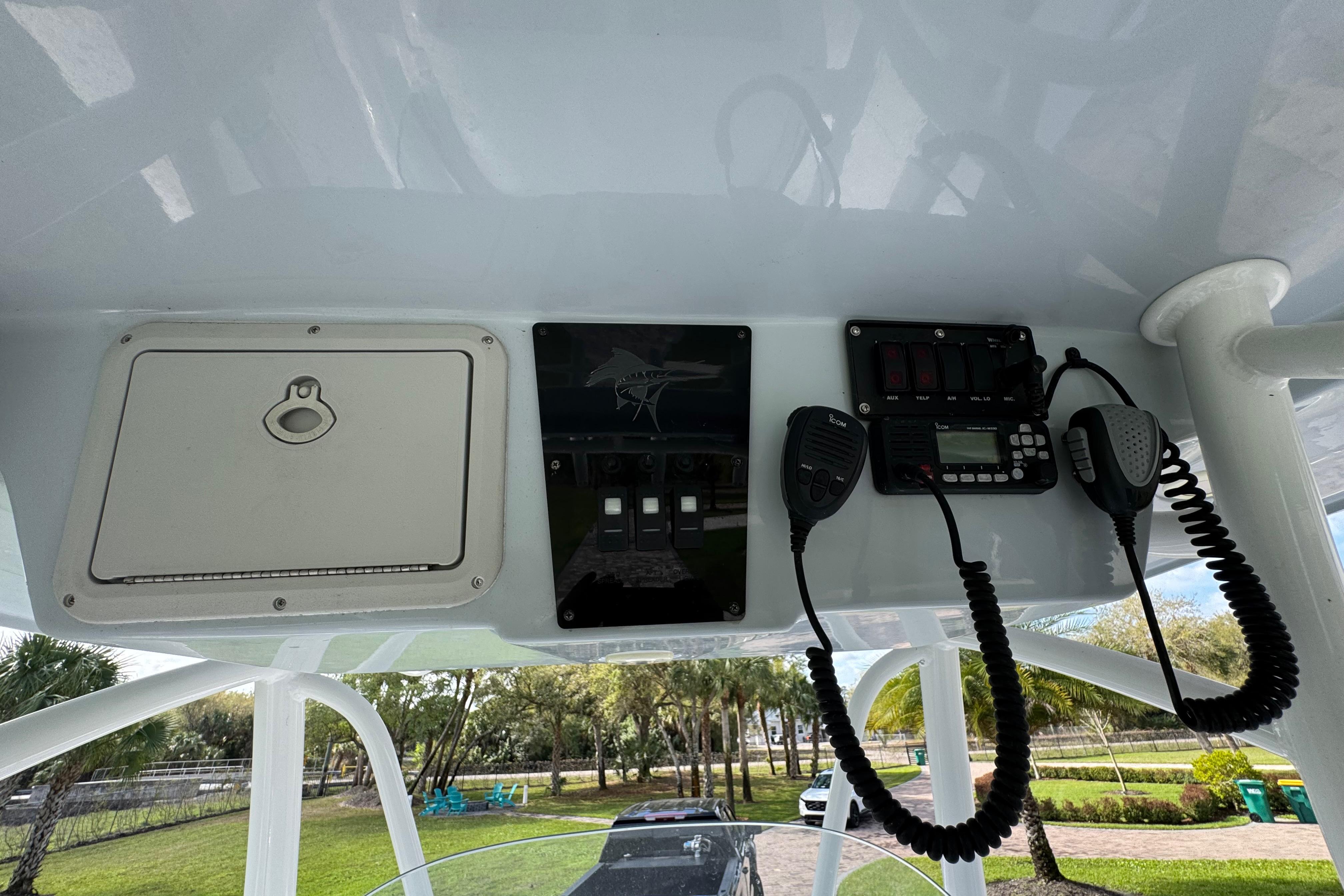 2022 Aquasport 2500 Center Console dashboard with radio and control panel.