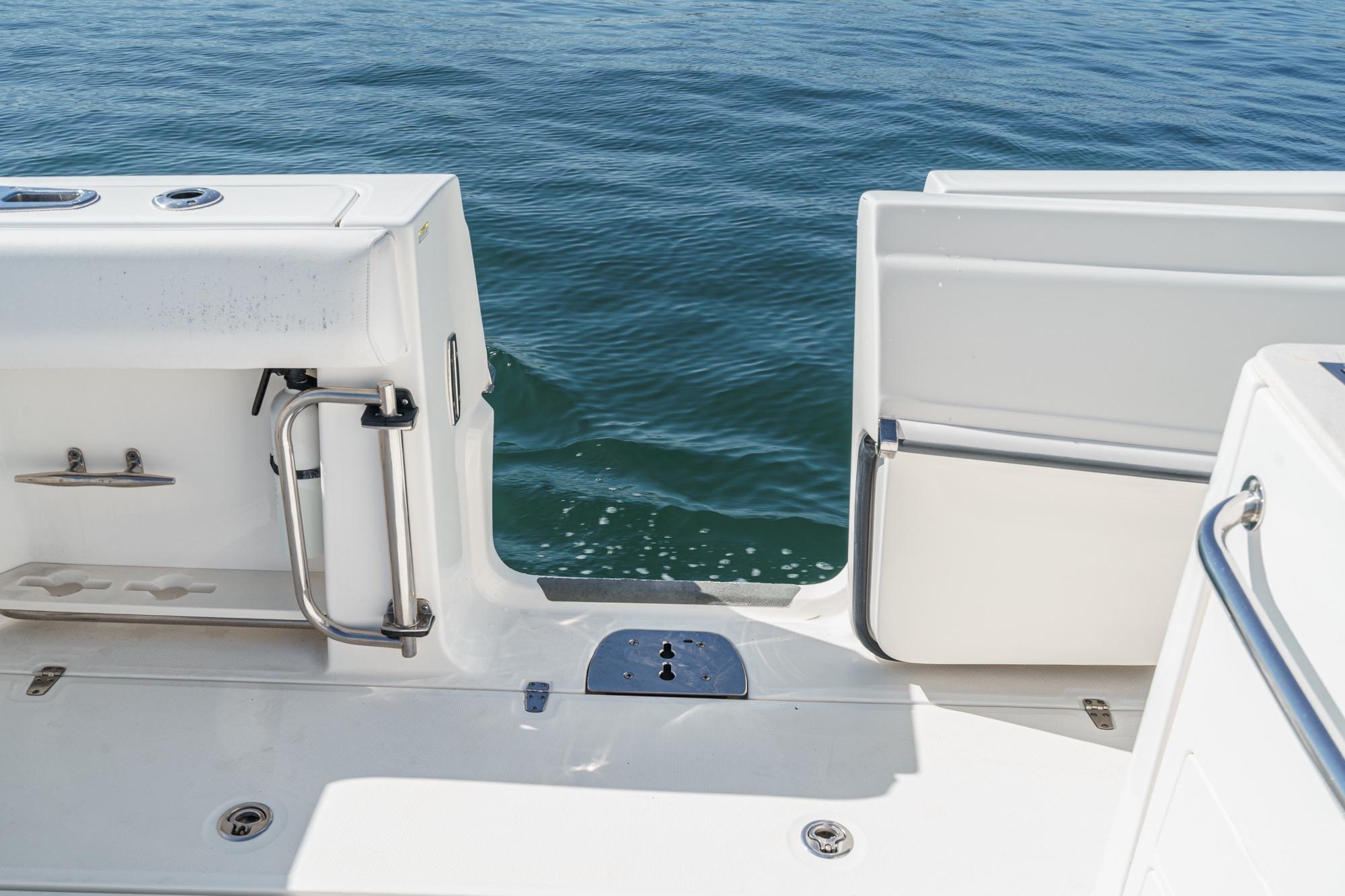 Boston Whaler 370 Outrage 2015 boat deck with open transom door, ocean view.